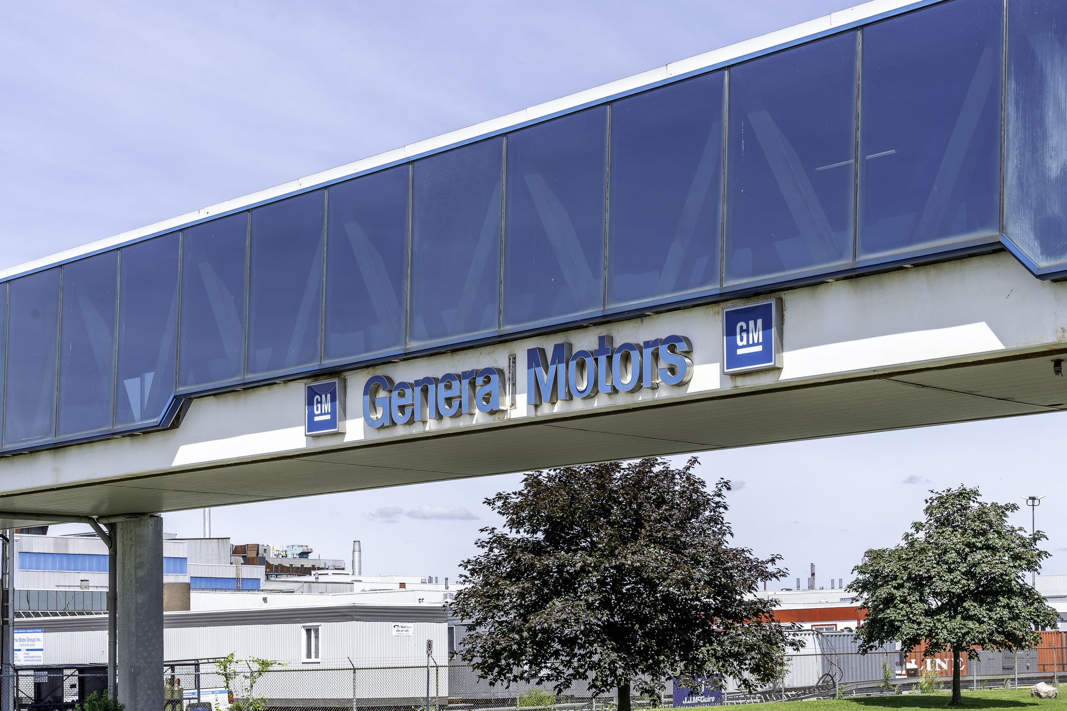 Oshawa, Ontario, Canada - July 01, 2019: Sign Of General Motors on the bridge at the GM Oshawa Car Assembly facility in Oshawa, Ontario, Canada.