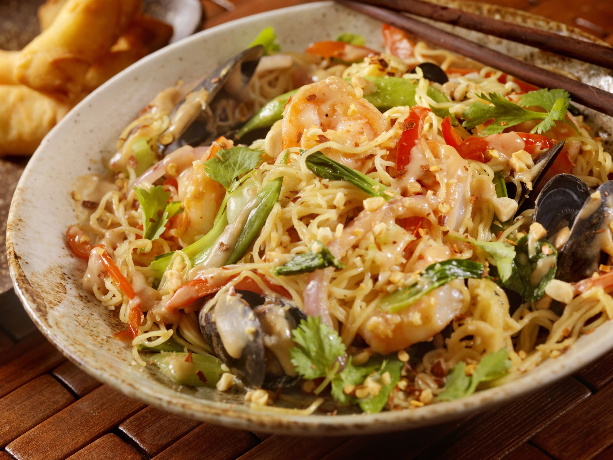 Thai, Noodle Stir fry with Shrimp, Mussels in a Peanut Sauce with Peppers and Cilantro -Photographed on Hasselblad H1-22mb Camera