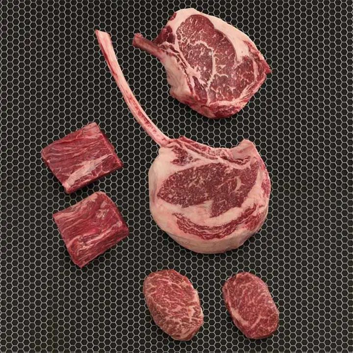 American Wagyu Party Package featuring tomahawk, ribeye, and cowboy steak.
