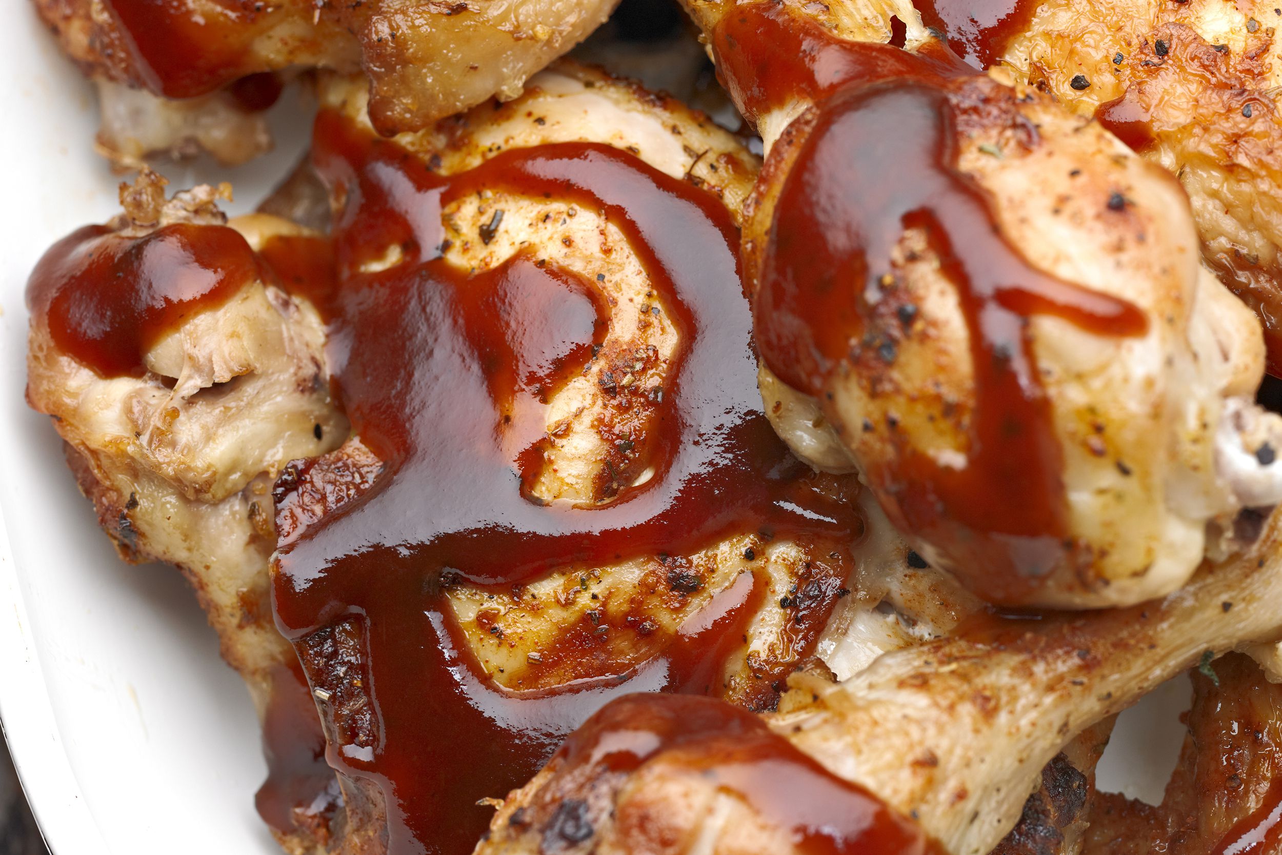 Closeup of easy after work BBQ chicken in a white plate