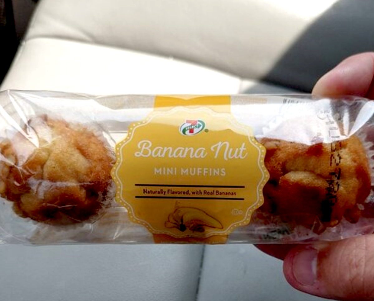 Hand Holding a Package of 7-Eleven Banana Nut Muffins, Over Front Passenger Seat