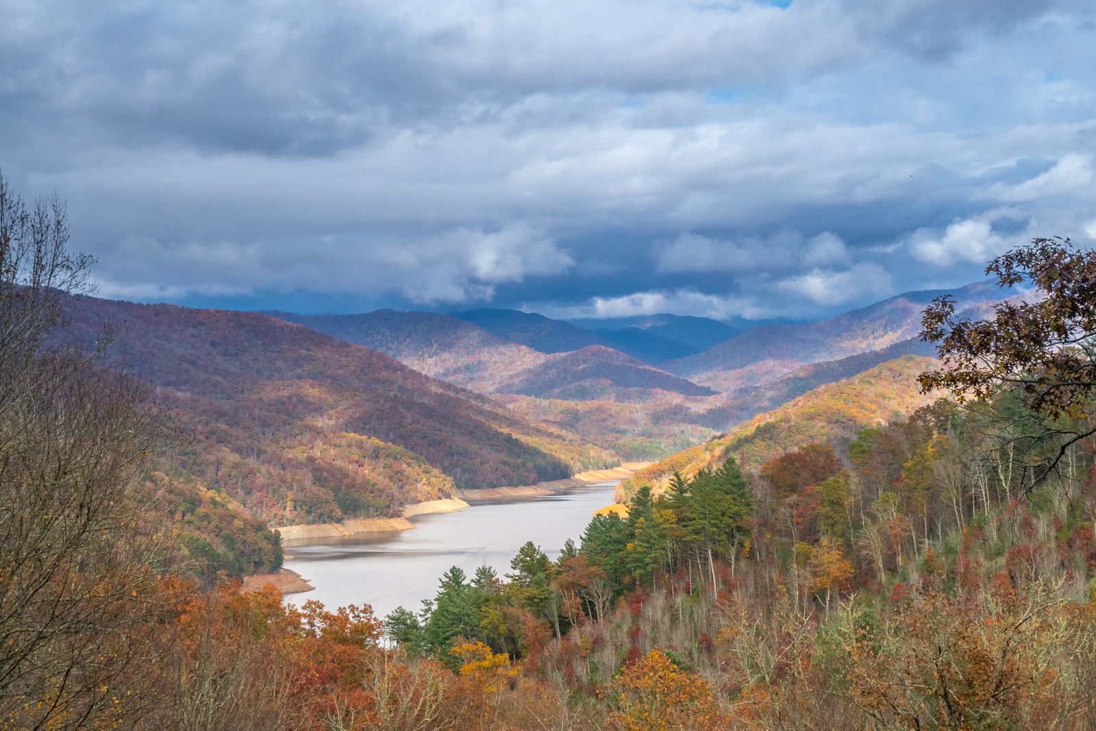 River meandering through hills in North Carolina on an overcast autumn day.