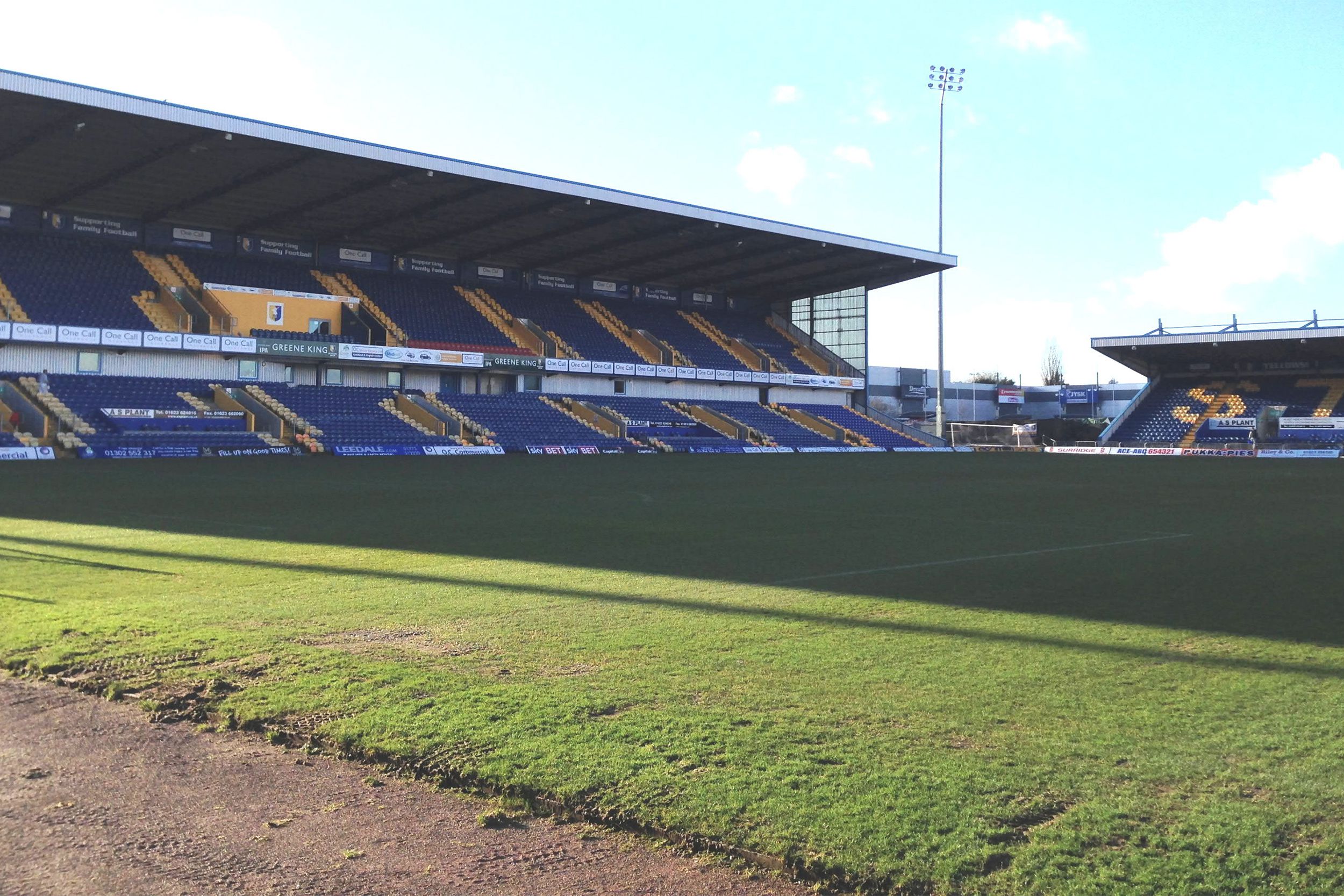 Empty One Call Stadium in Nottinghamshire, England on a sunny day.