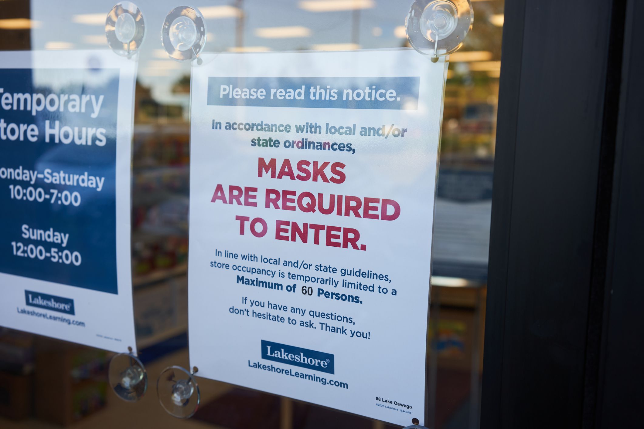 Lake Oswego, OR, USA - July 22, 2020: A mandatory mask policy notice is seen at the entrance to a Lakeshore Learning store. Oregon is extending its face mask policy as COVID-19 cases continue to rise.