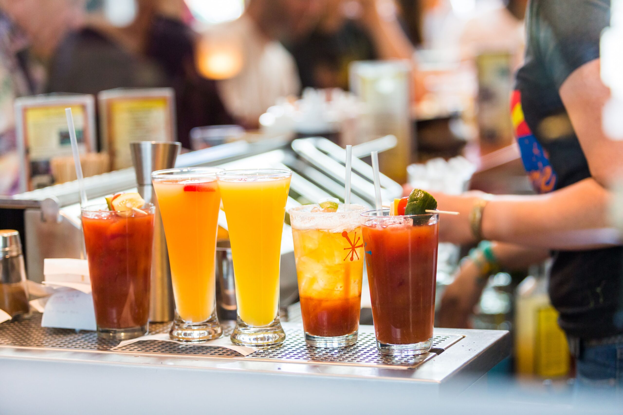 Row of cocktails for brunch at the bar.