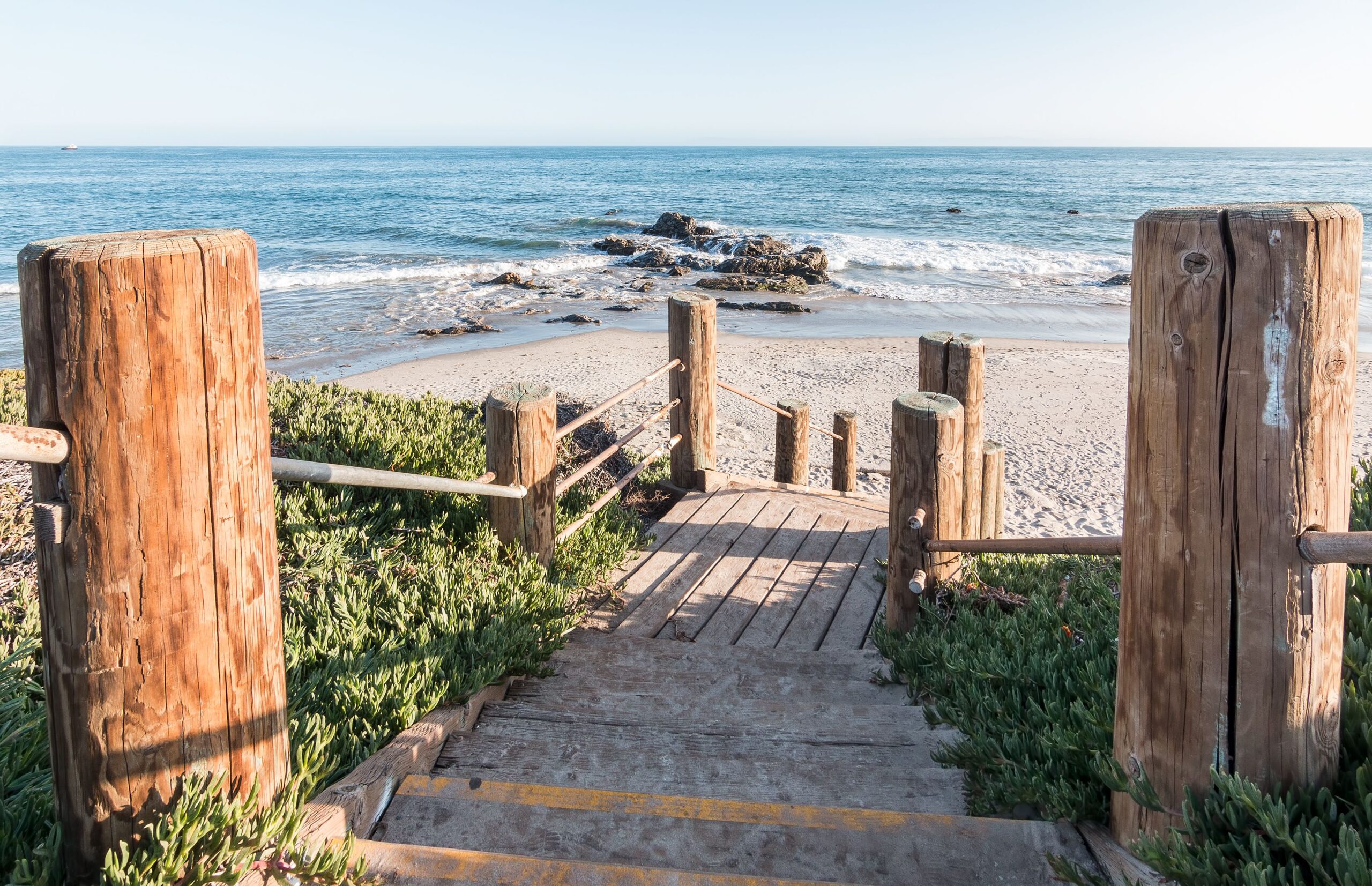 Stairs leading down to the beach and Pacific ocean at Carpinteria State Beach, California.