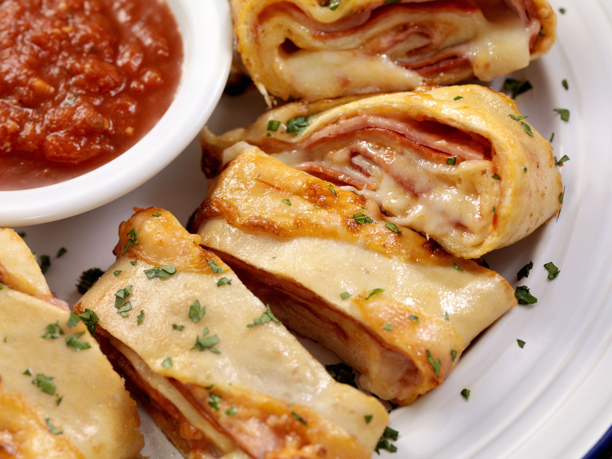 Authentic Hand Made Italian Stromboli with Pepperoni, Ham, Fresh Parmesan and Marinara Sauce - Photographed on a Hasselblad H3D11-39 megapixel Camera System