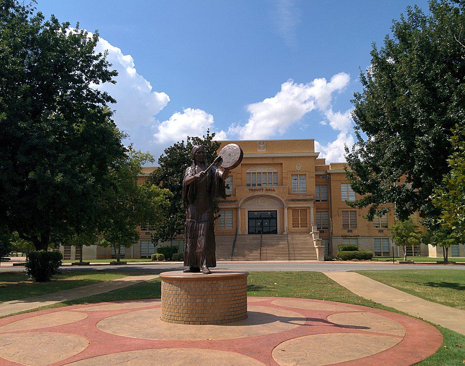 Bronze statue in Chickasha, OK in summer