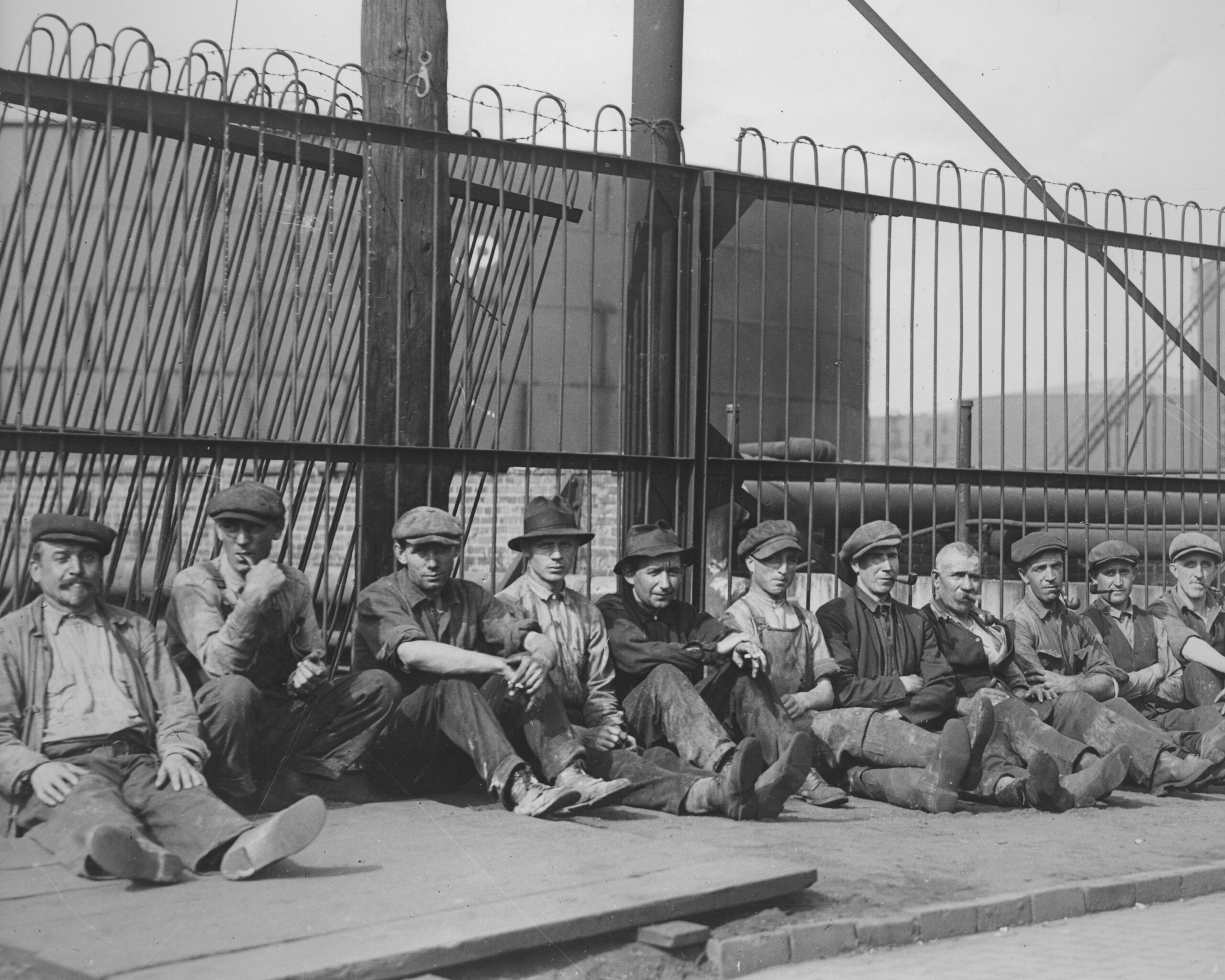 workers on their lunch break at the standard oil refinery at bayonne, new jersey, circa 1920