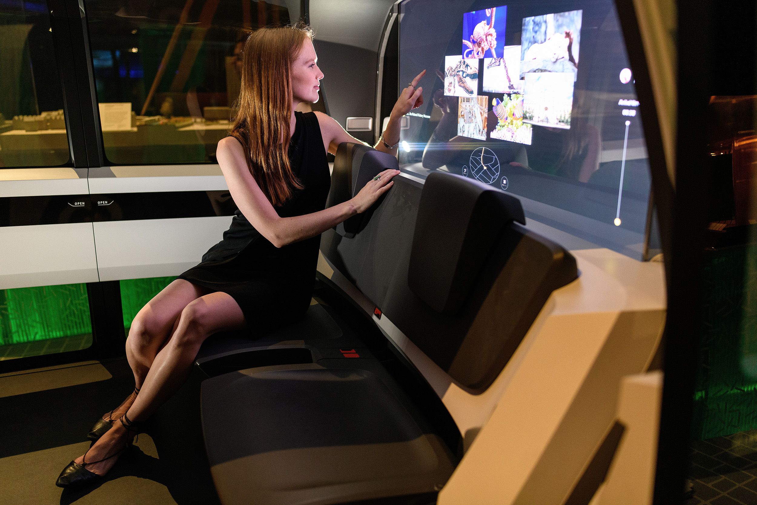 a gallery assistant sits inside the 