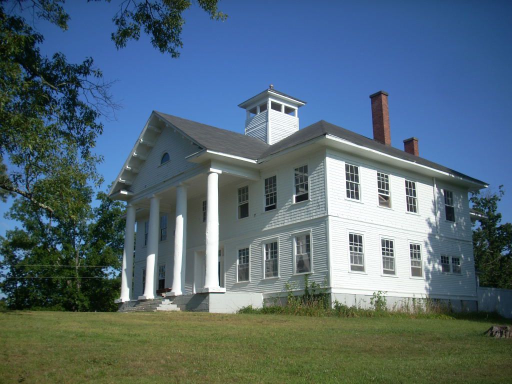 Huge white house with columns in summer in Long Creek, South Carolina
