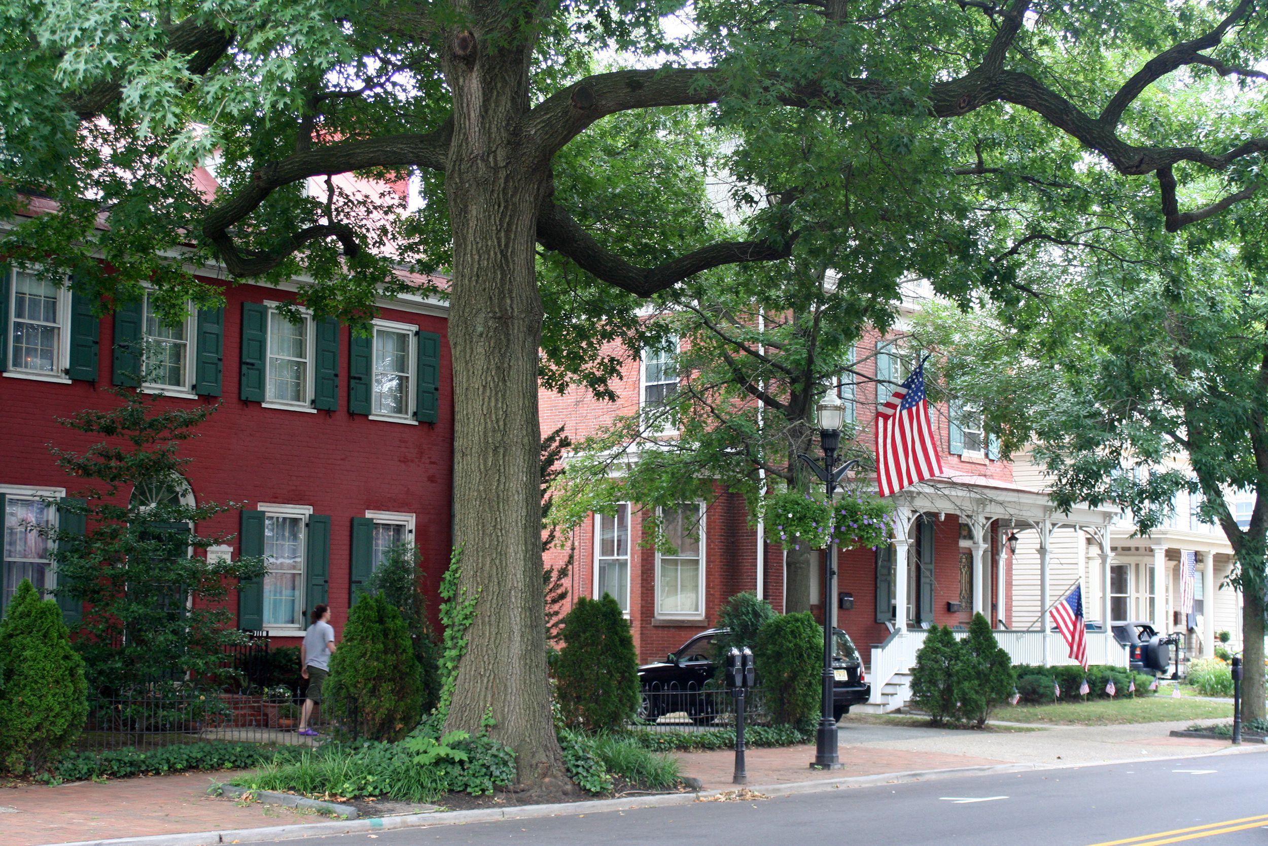 Large historic brick homes on street lined with mature trees Moorestown, NJ