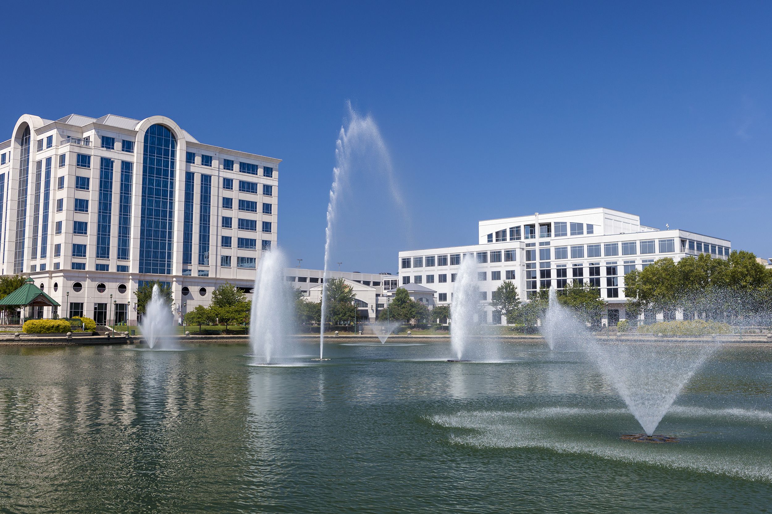 Large water feature with fountains in Newport News, VA on a clear summer day