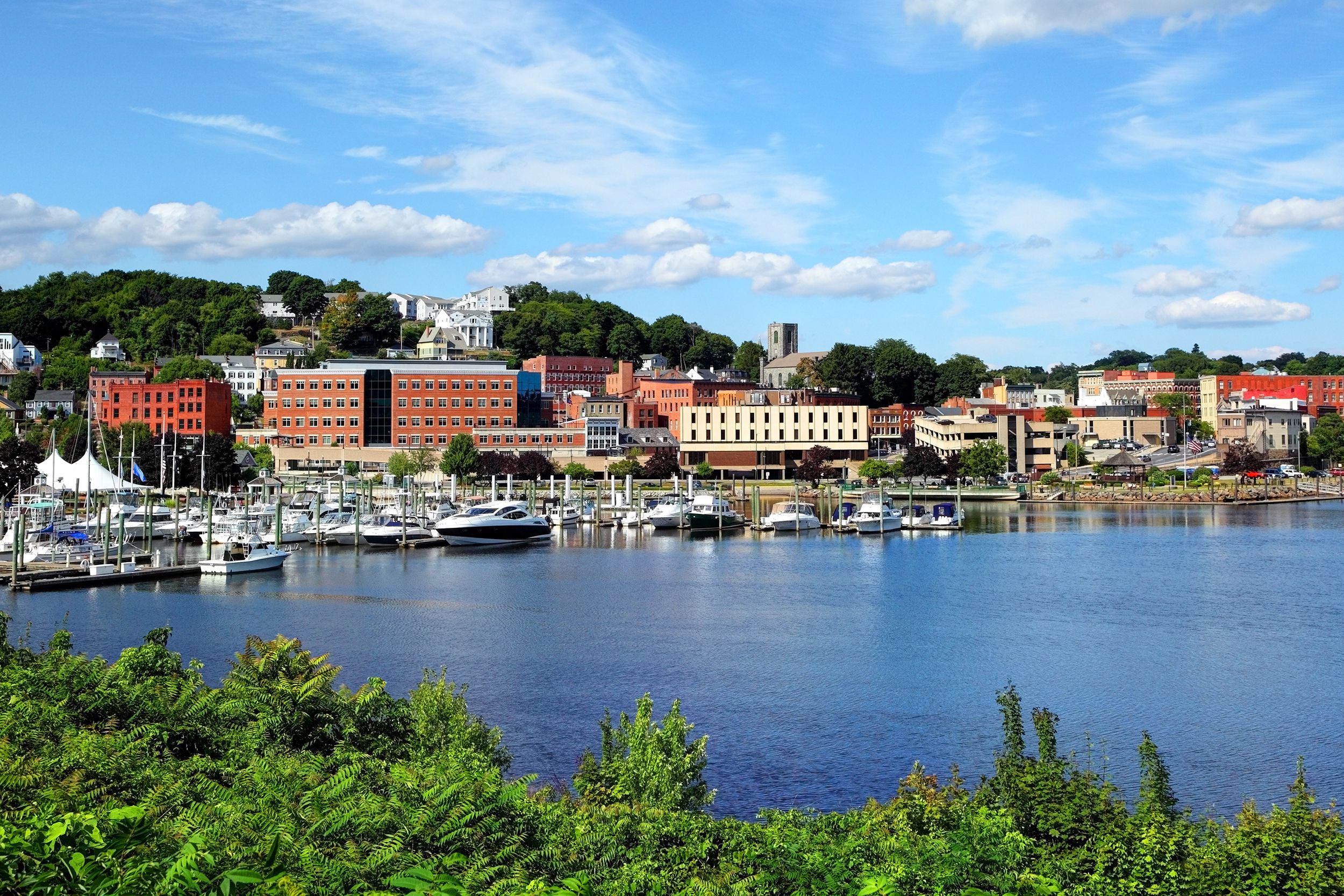 View over water of Norfolk, CT on a sunny summer day.