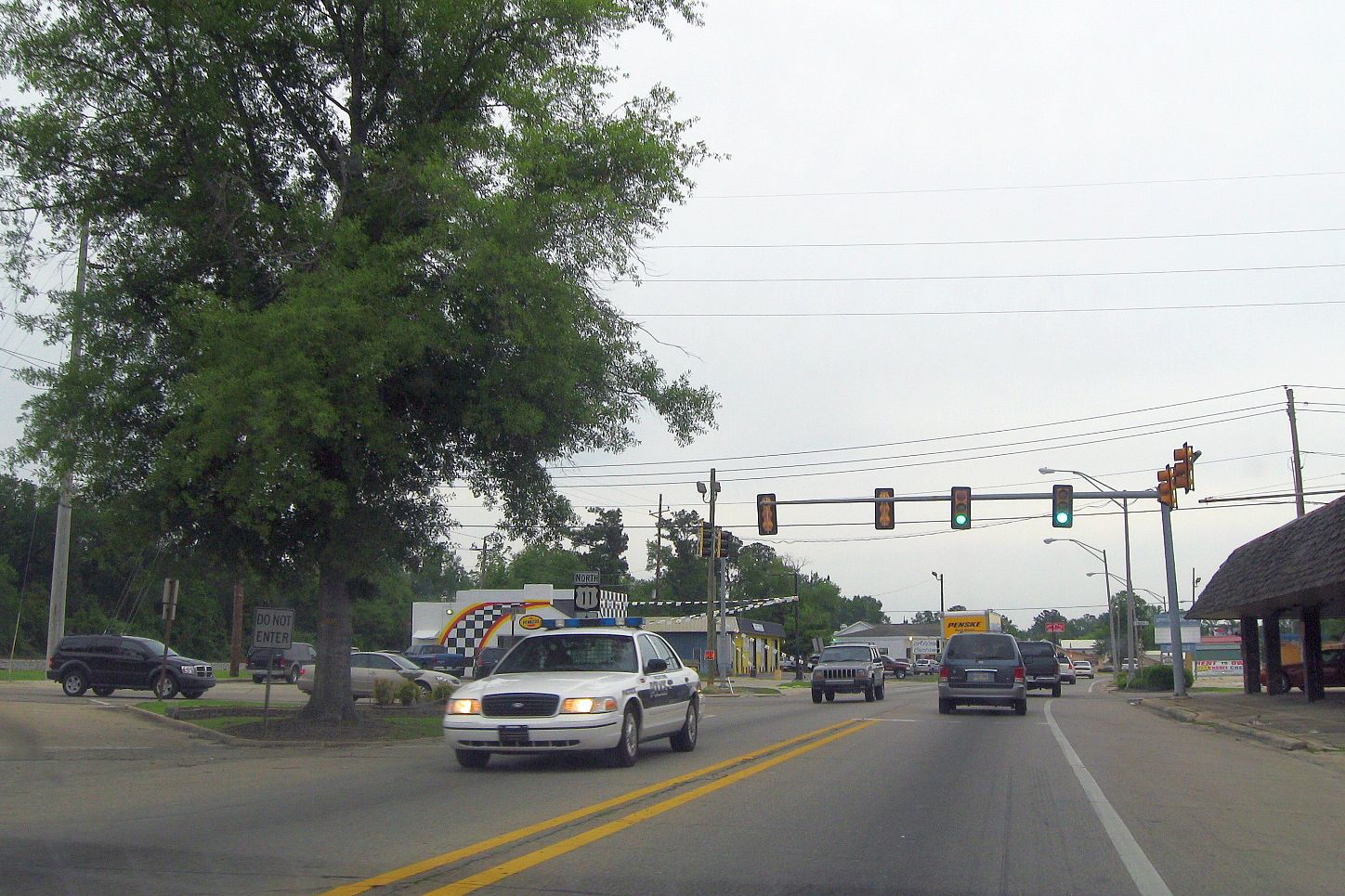 Cop car driving down street in Picayune, MS
