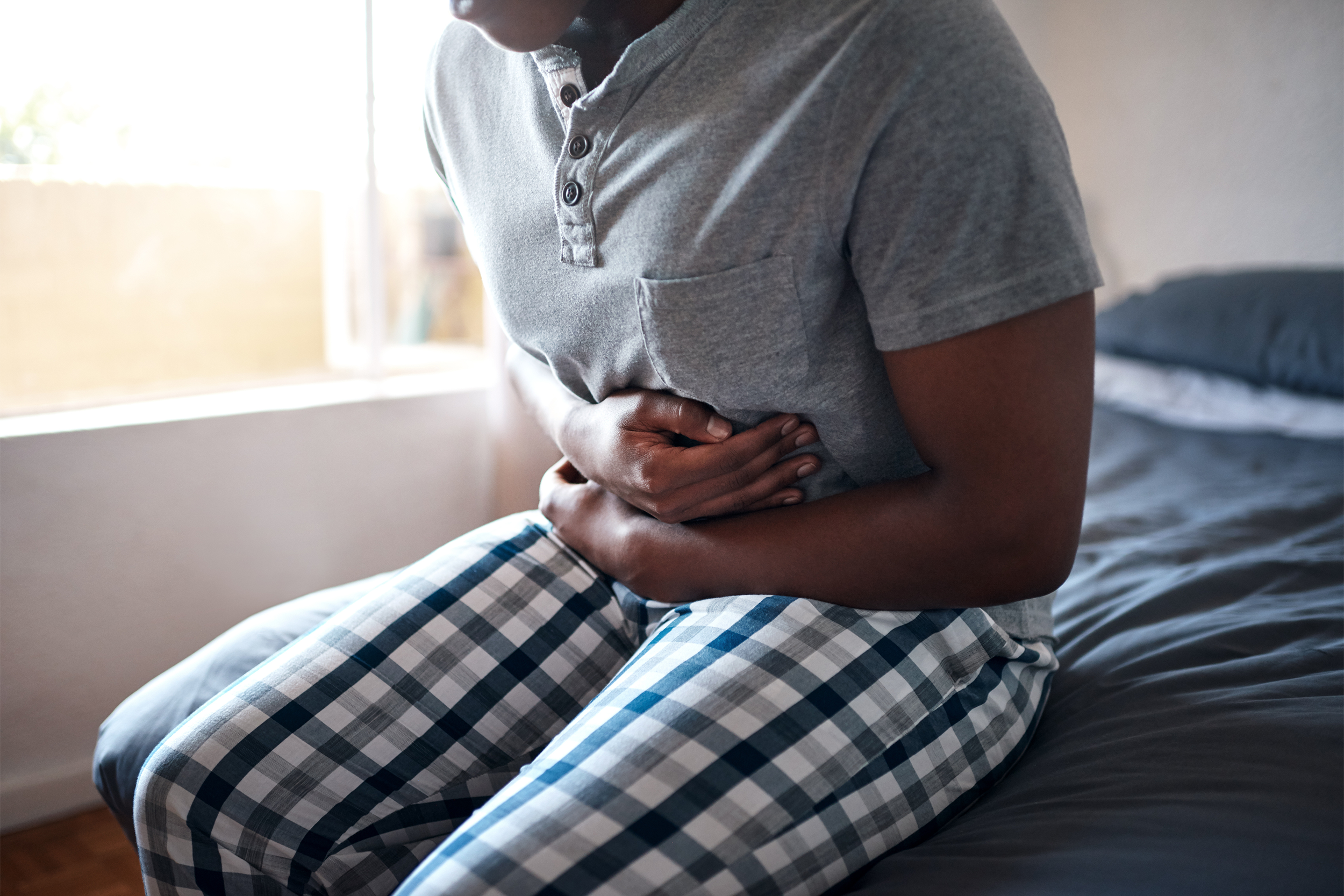 man holding stomach