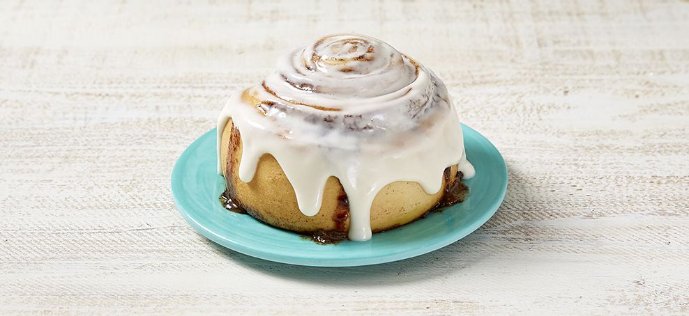 cinnabon cinnamon roll on a blue plate