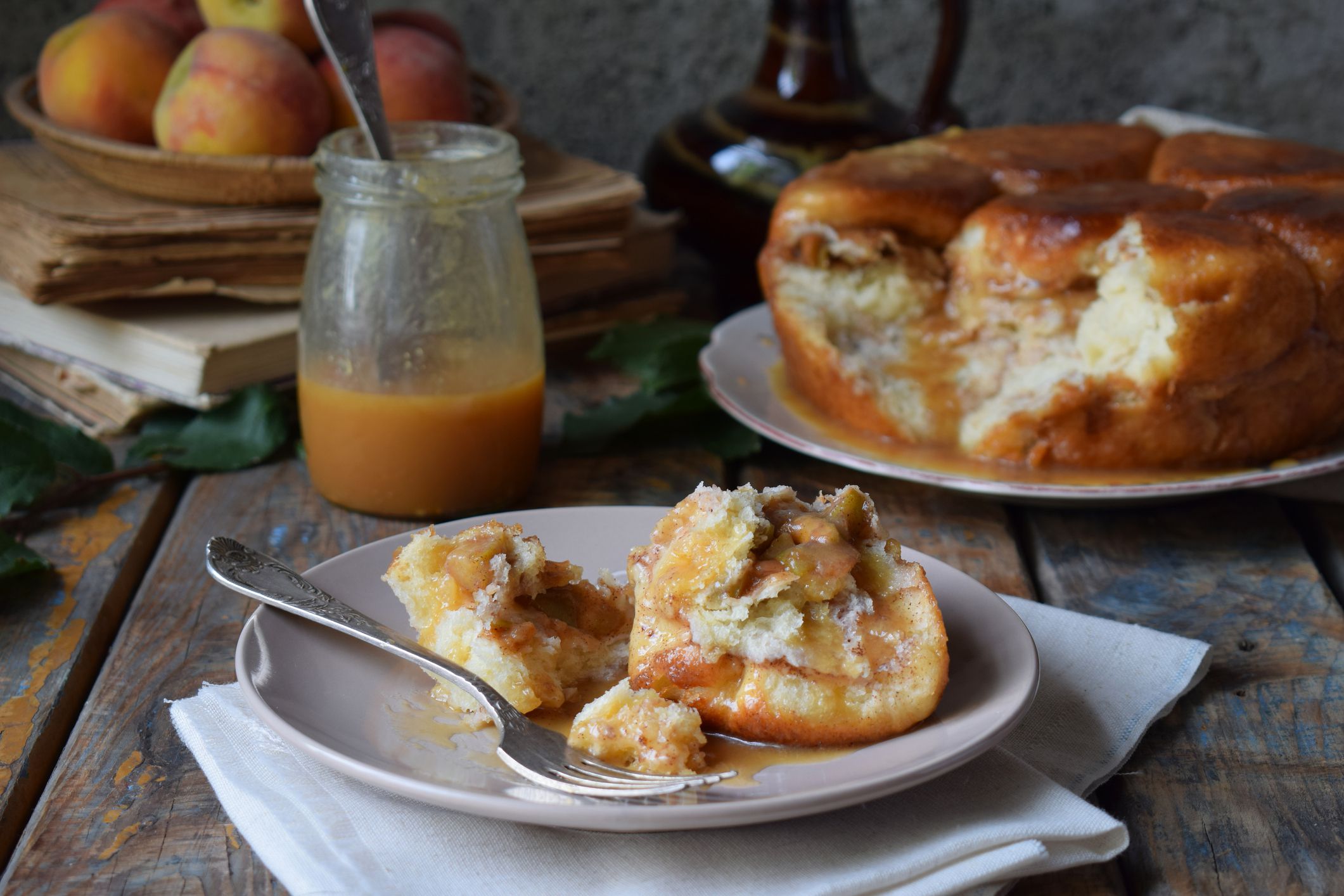 Caramel monkey bread. Apple pie with brown sugar and cinnamon on a wooden background. Autumn baking. Homemade sweets. Rustic style. Copy space