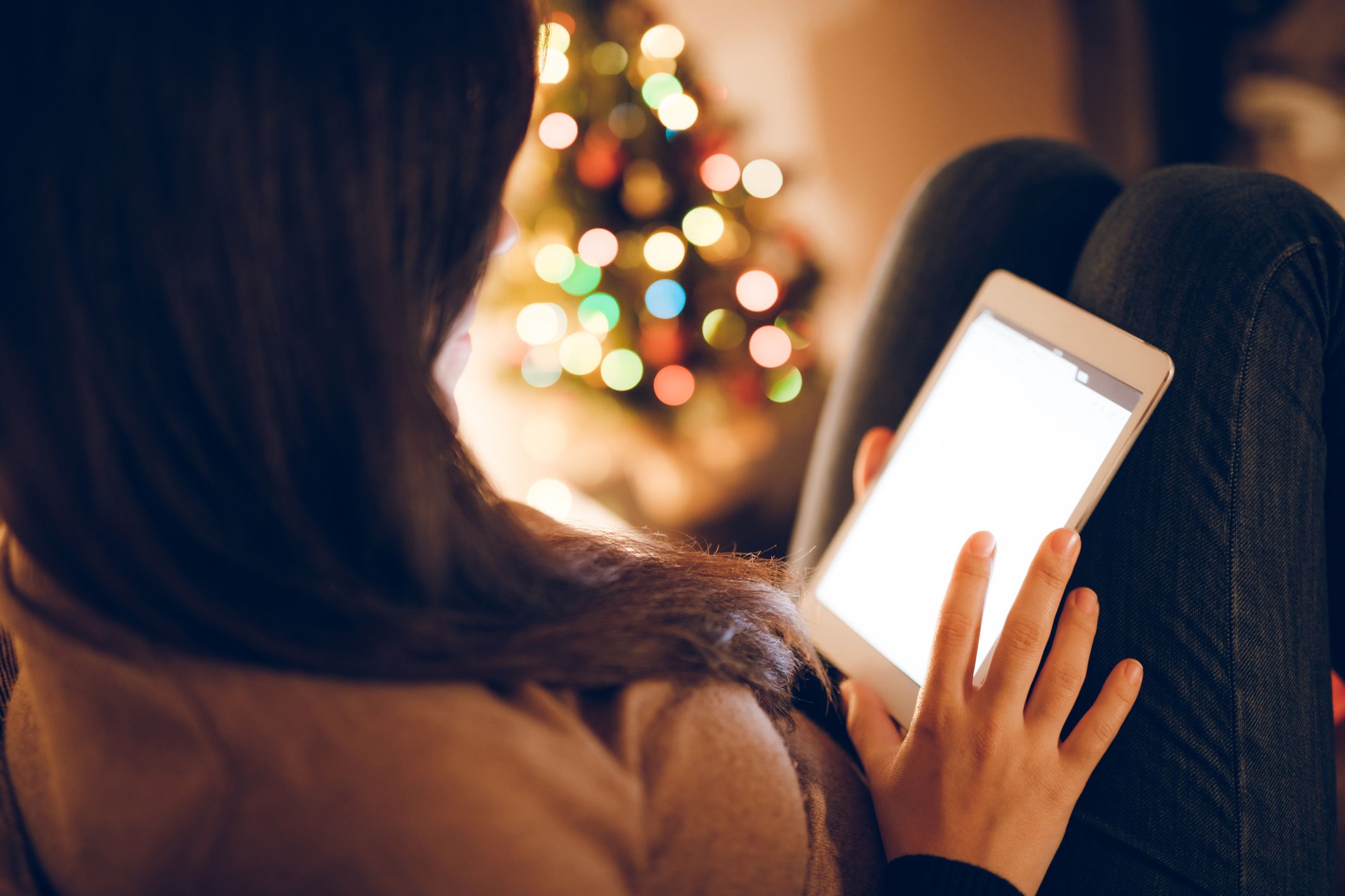 Young woman using digital tablet at home