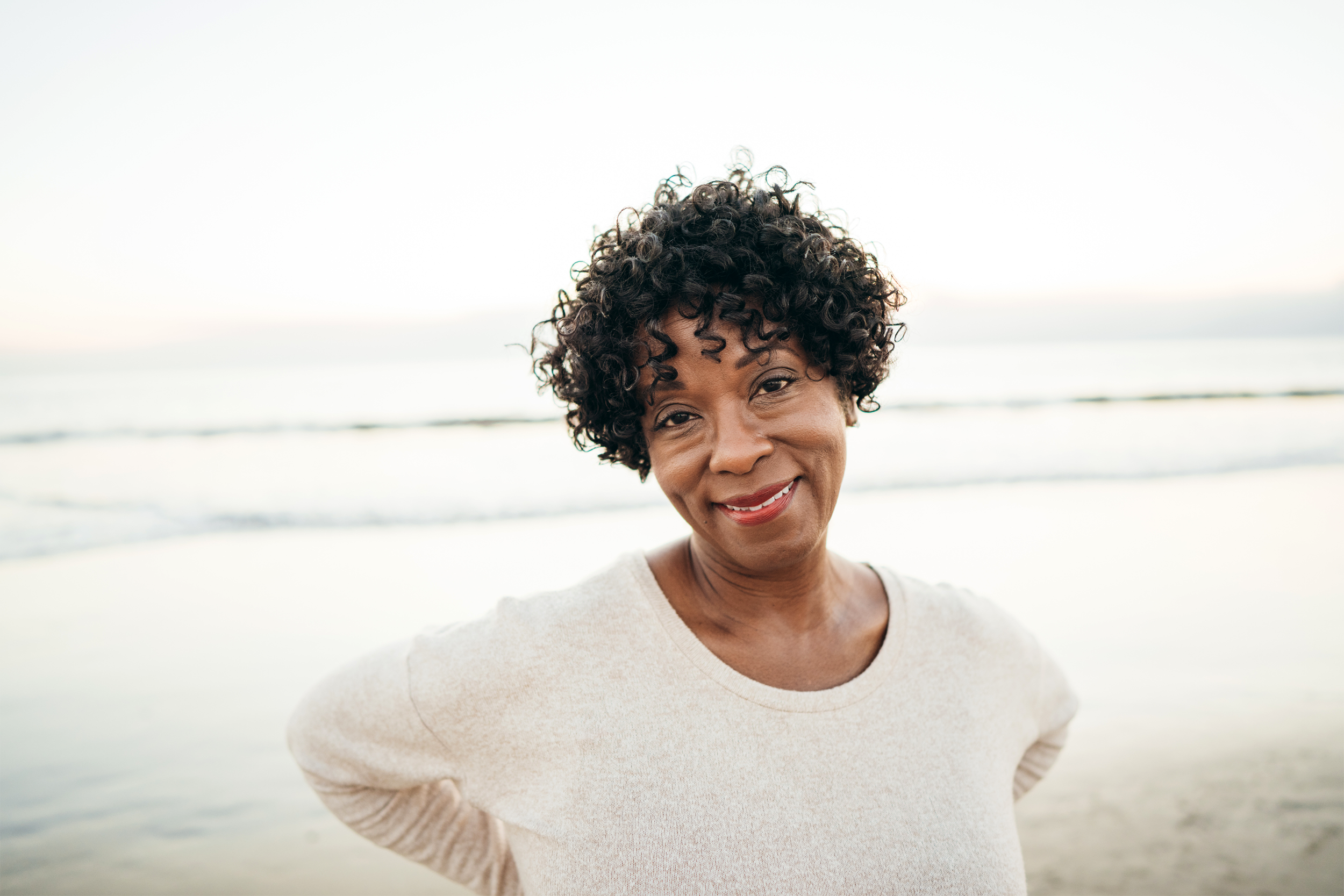 woman smiling on the beach