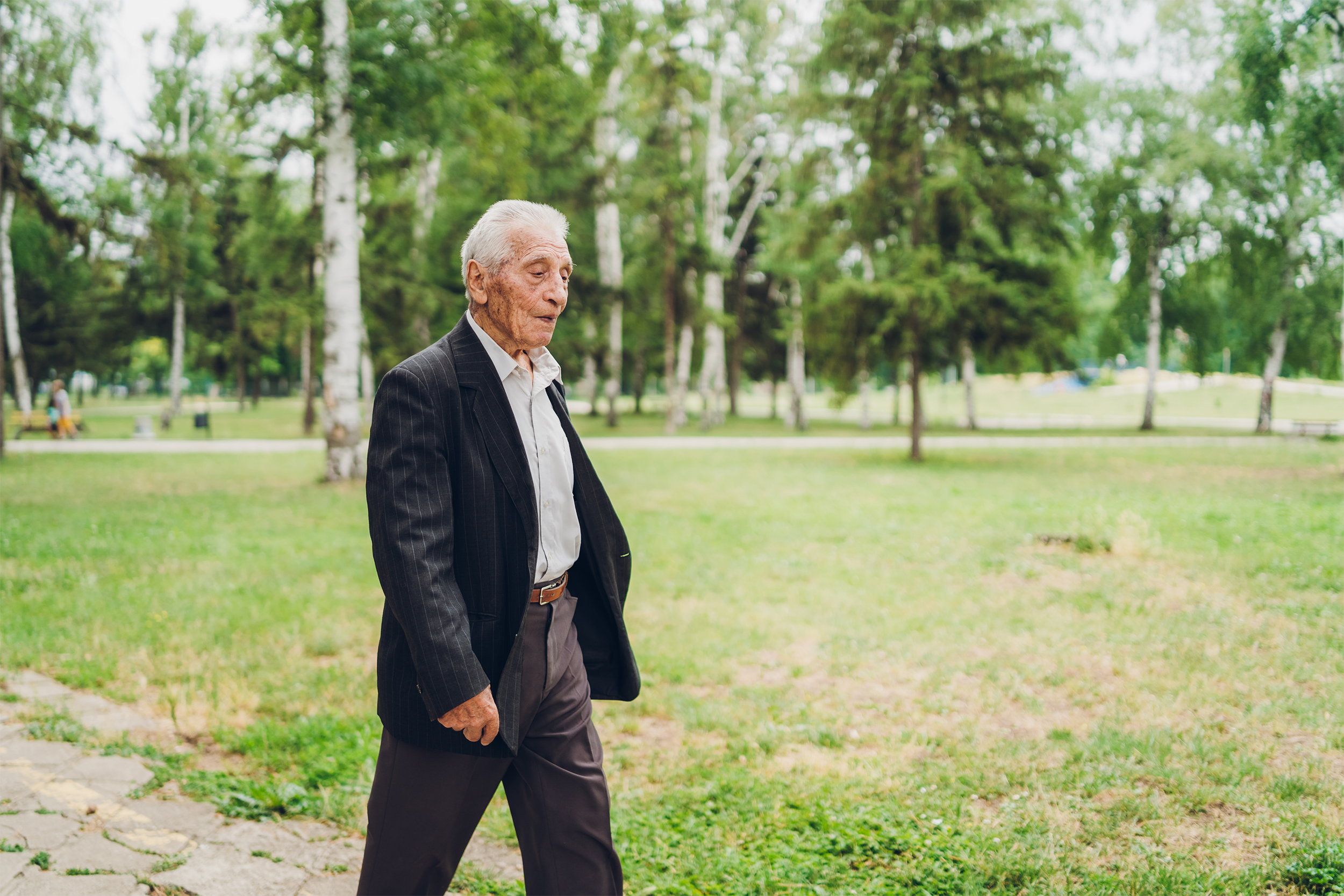senior man walking outside