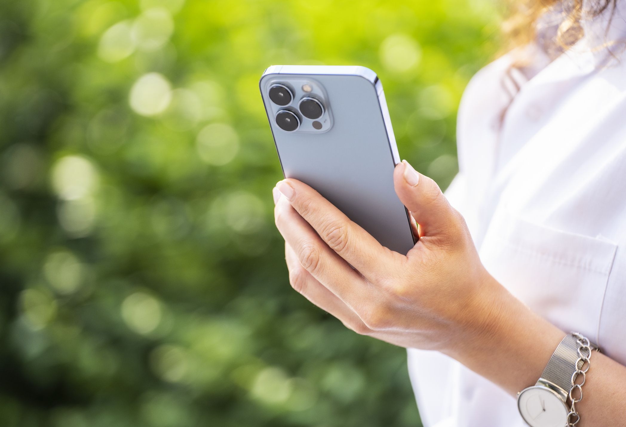 Hand holding a smartphone, close up