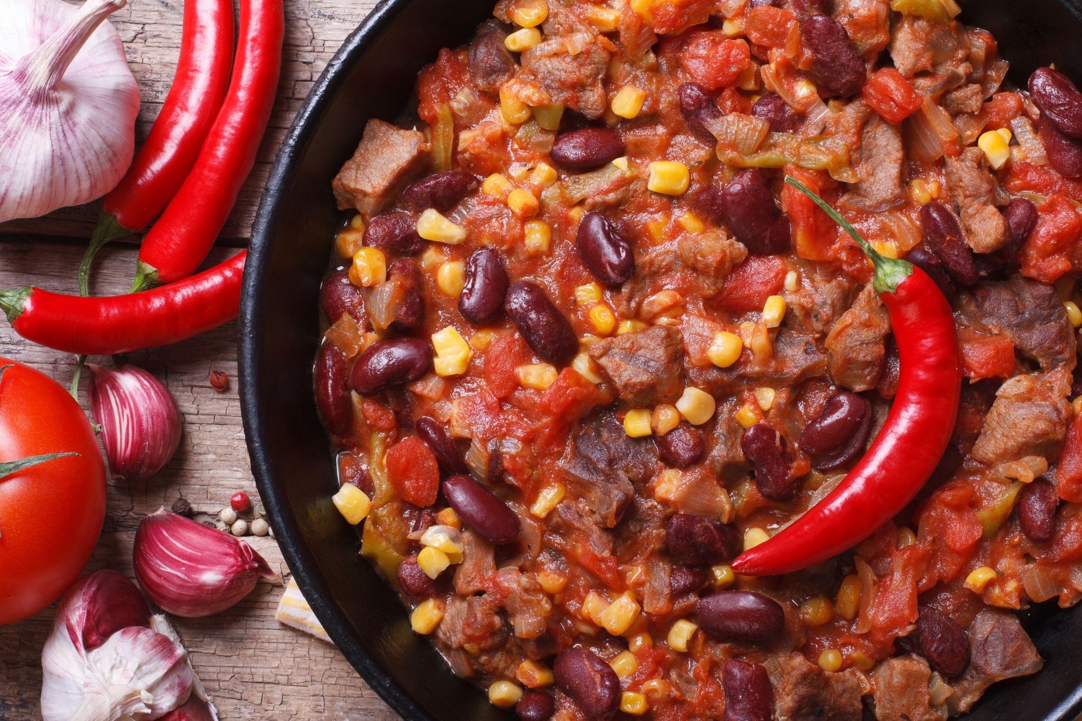 Mexican food chili con carne macro and ingredients. horizontal top view