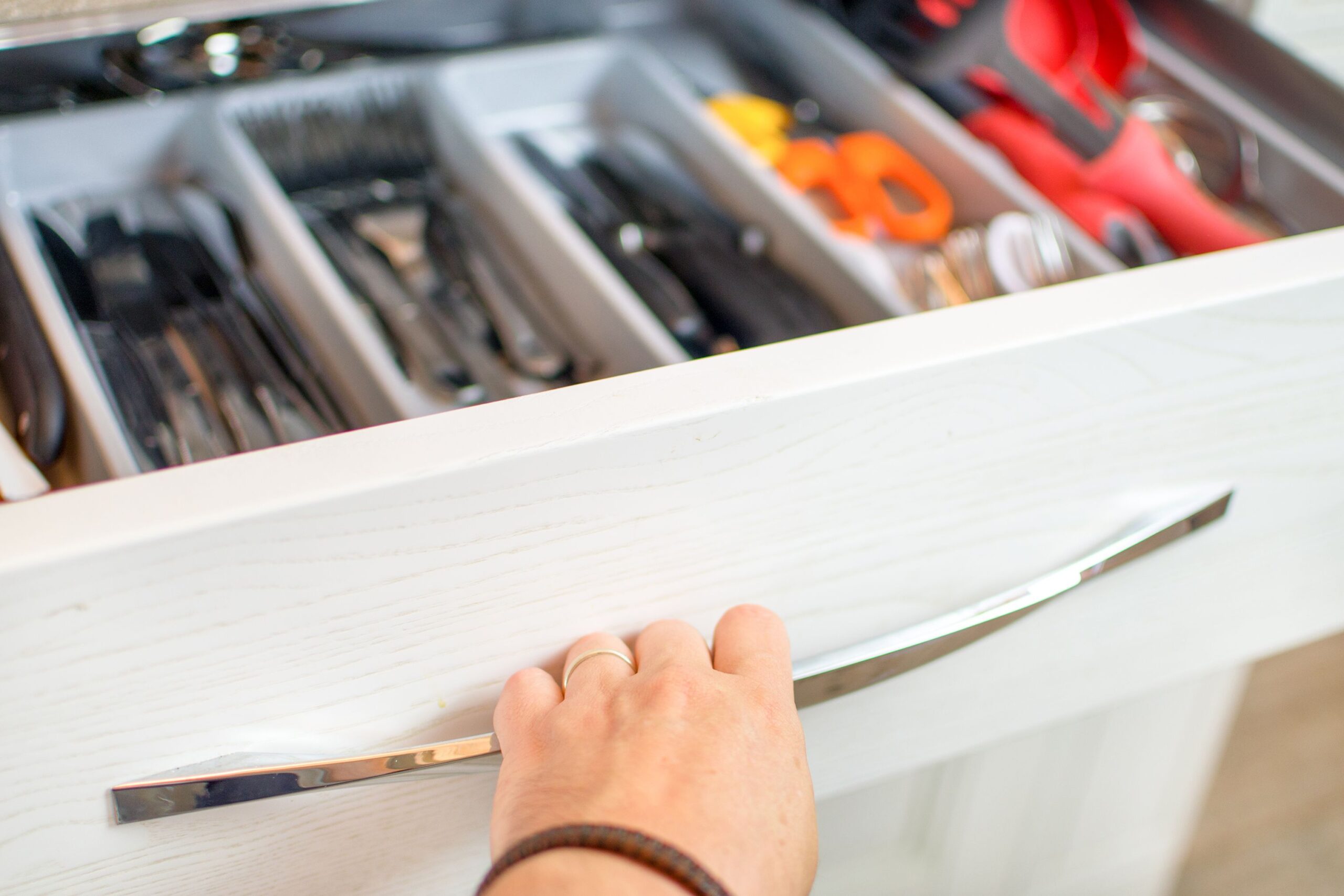 hand opening drawer with knives and scissors