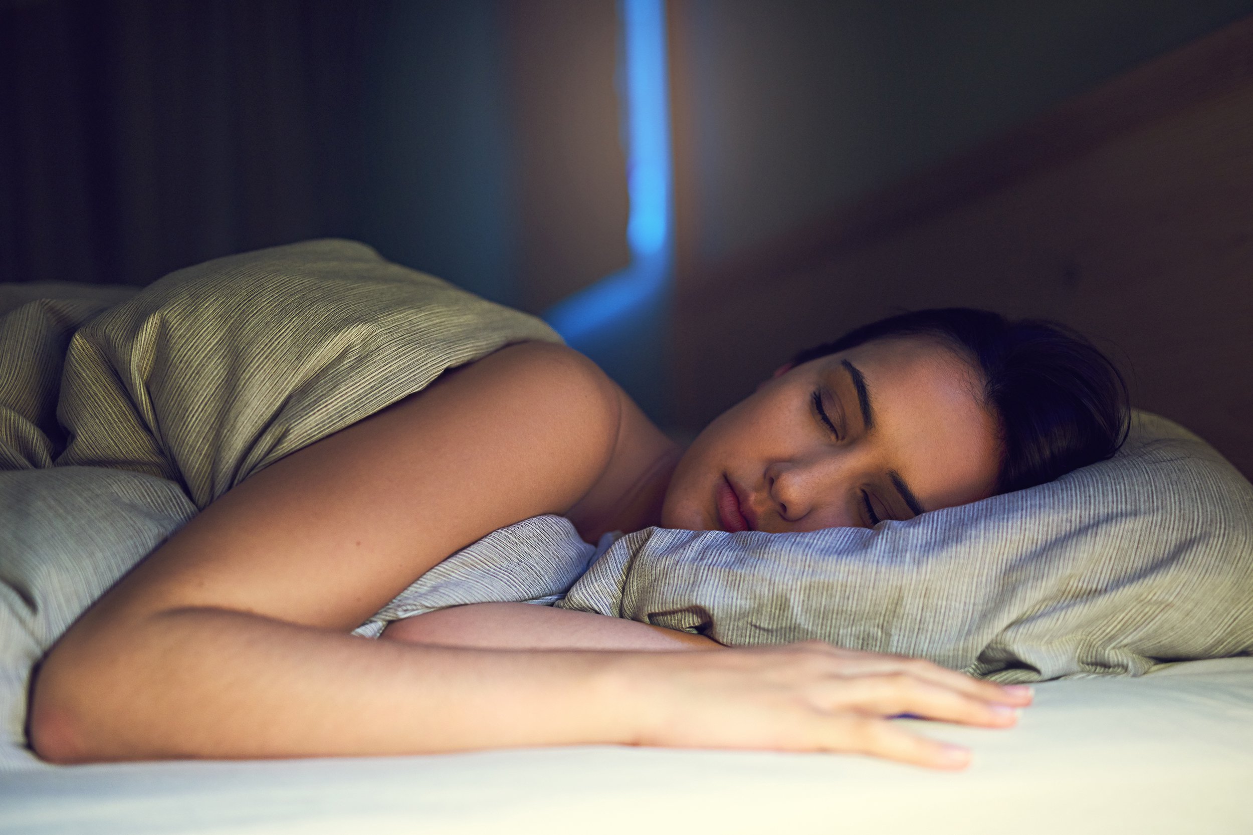 woman sleeping in bed at night