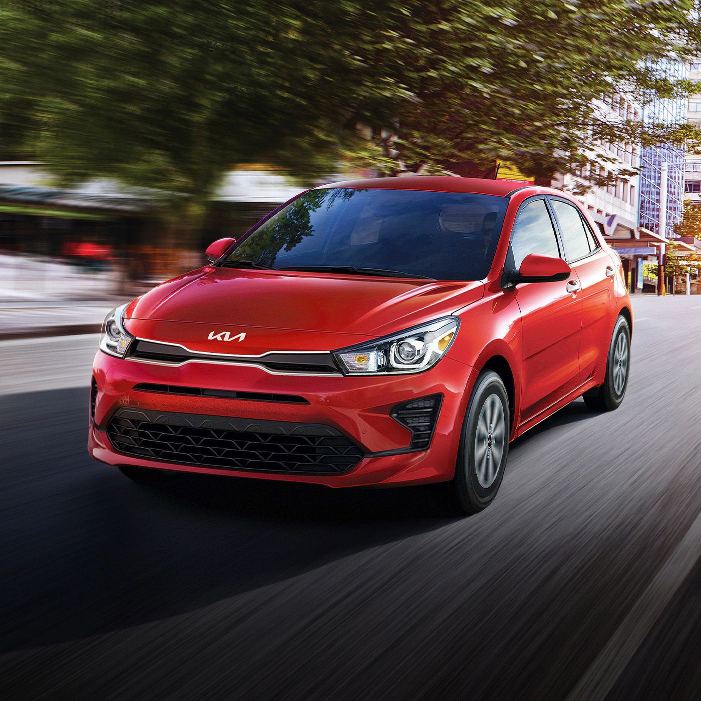 Red 2023 Kia Rio on a road
