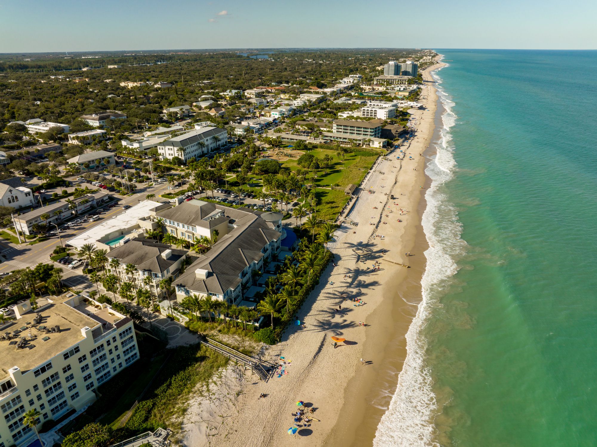 Aerial of hotels and buildings along coast of Vero Beach, Florida with ocean