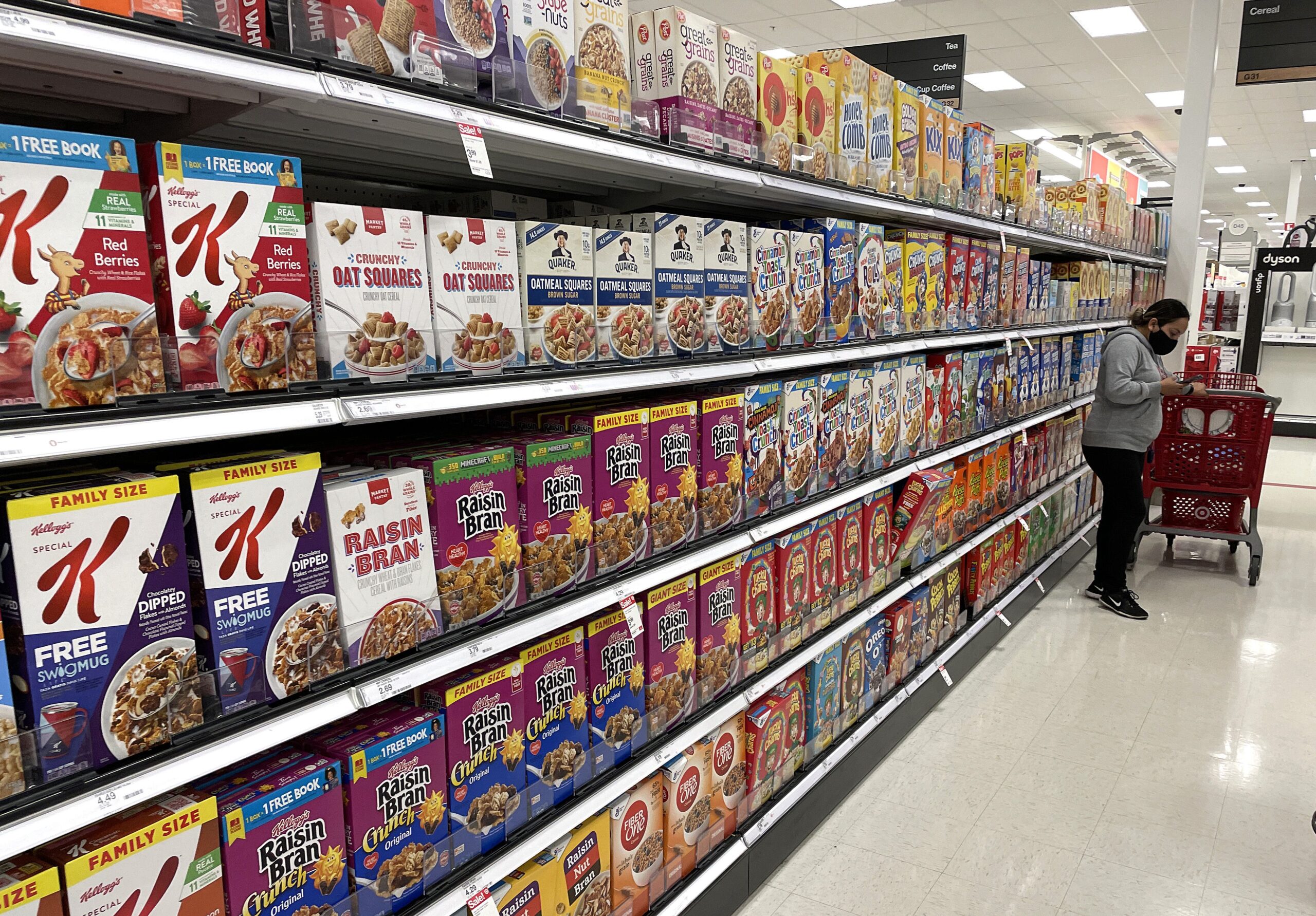 Boxes of cereal are displayed on a shelf at a Target