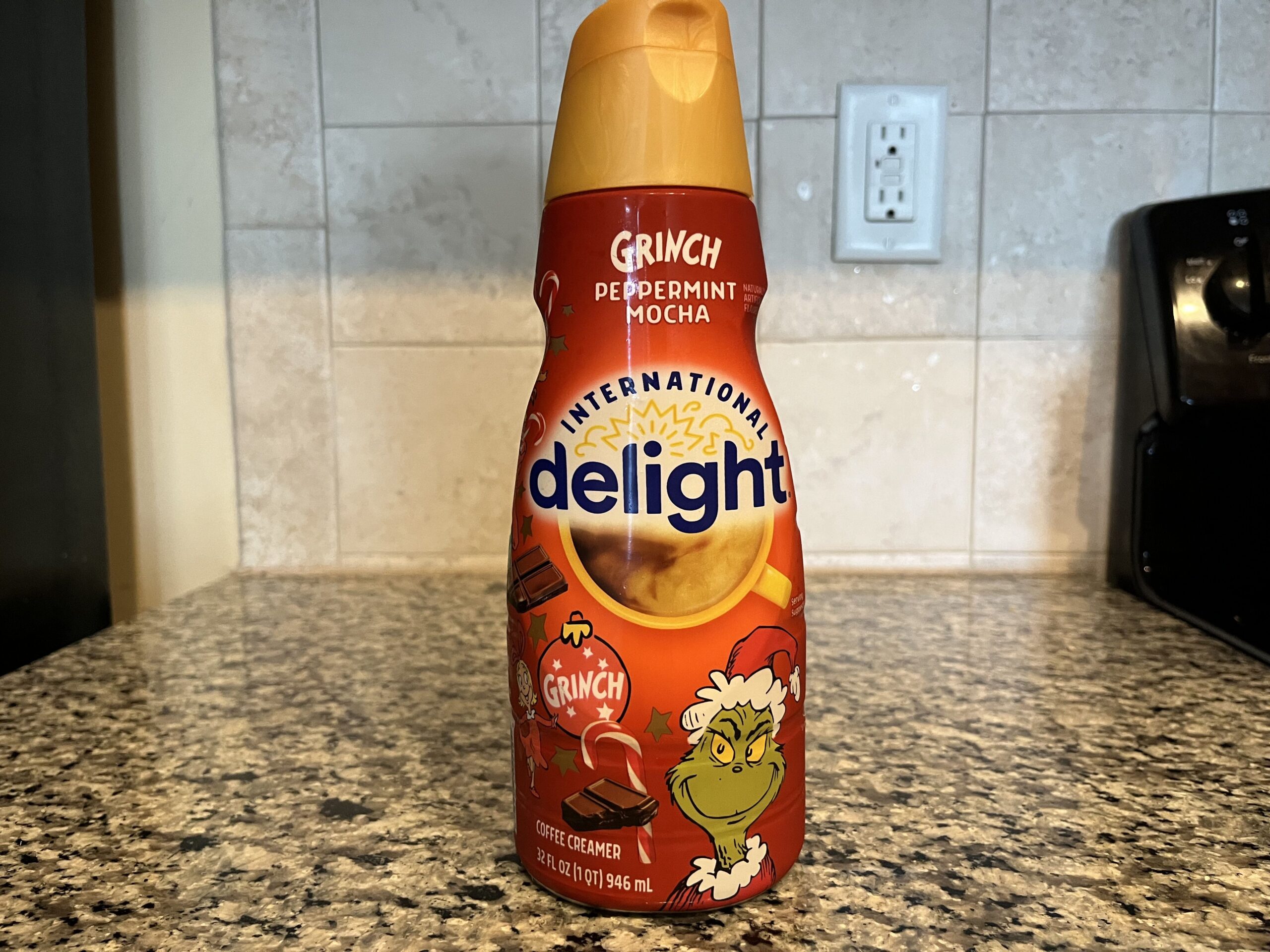 bottle of peppermint mocha coffee creamer with the grinch