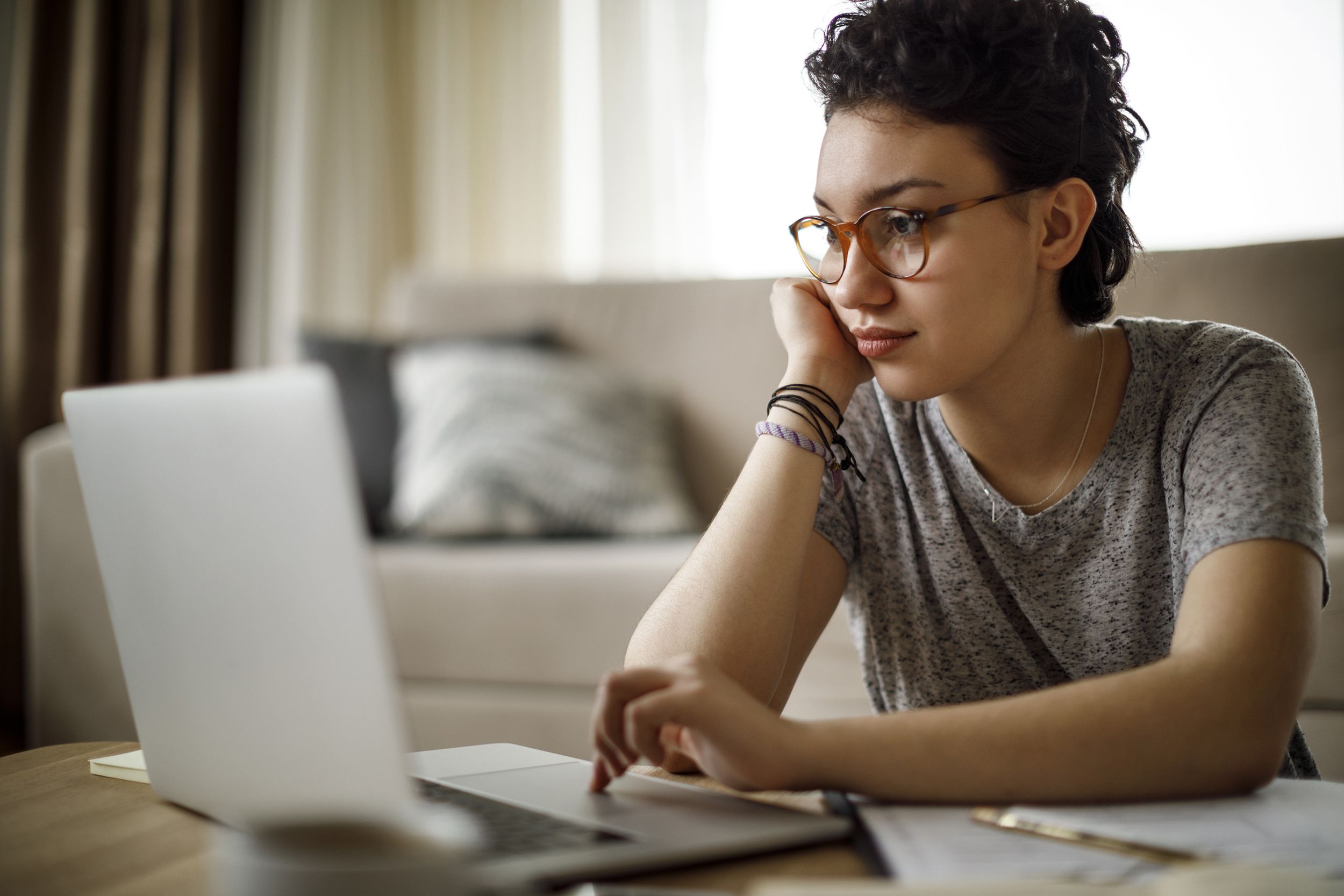 young woman on laptop at home