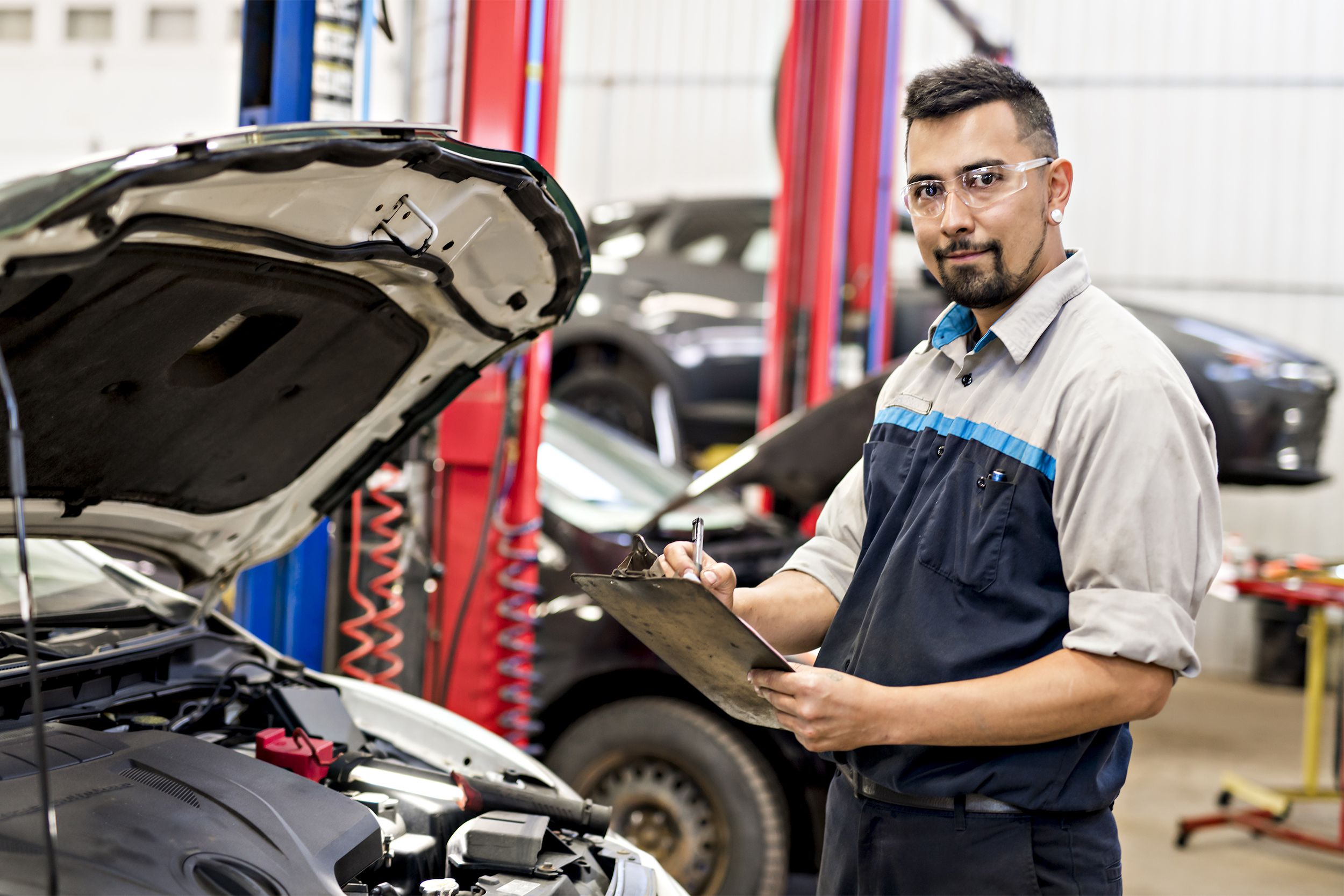 Mechanic giving a car inspection