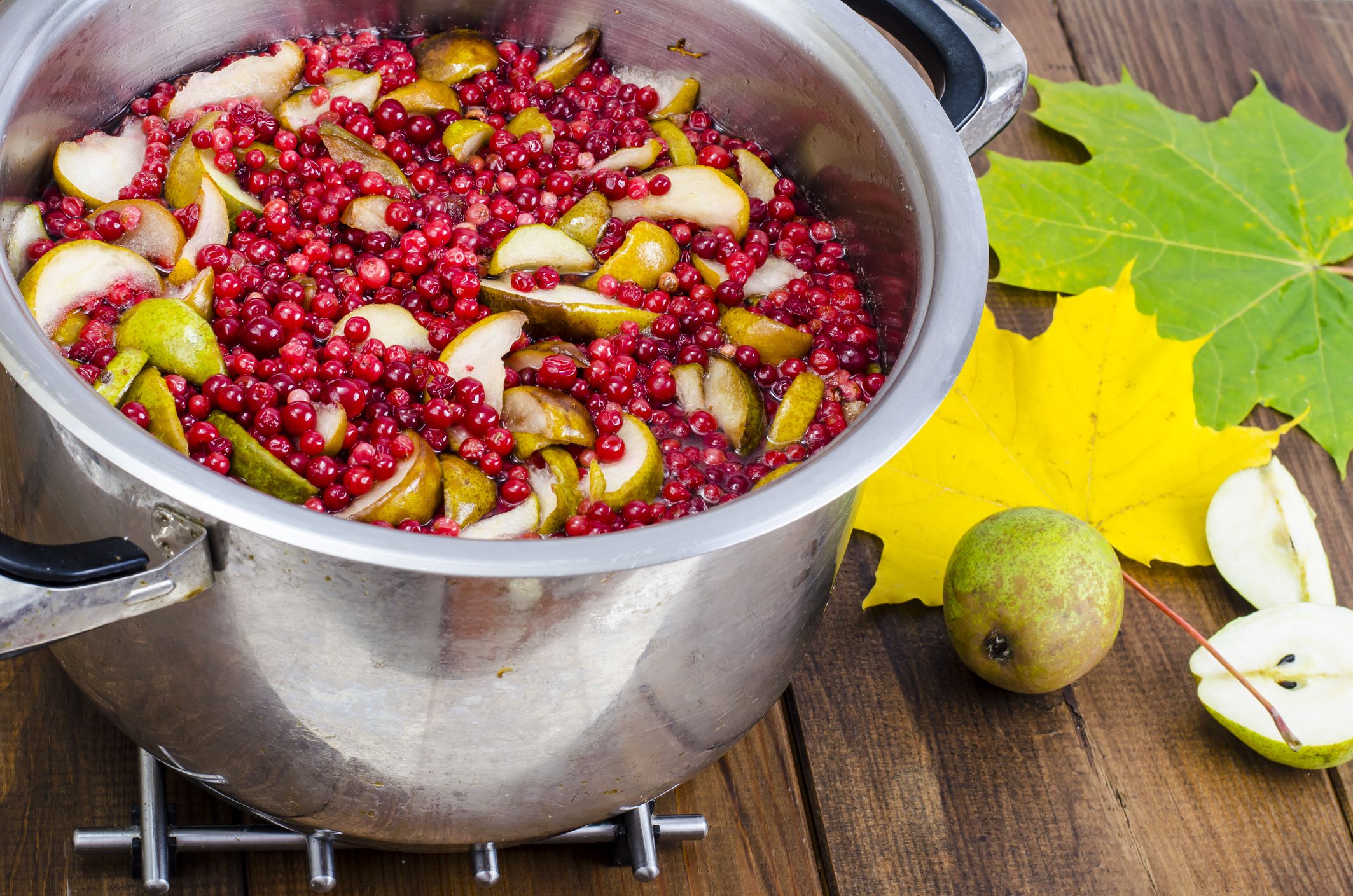 Cooking fresh pear and cranberry. Studio Photo
