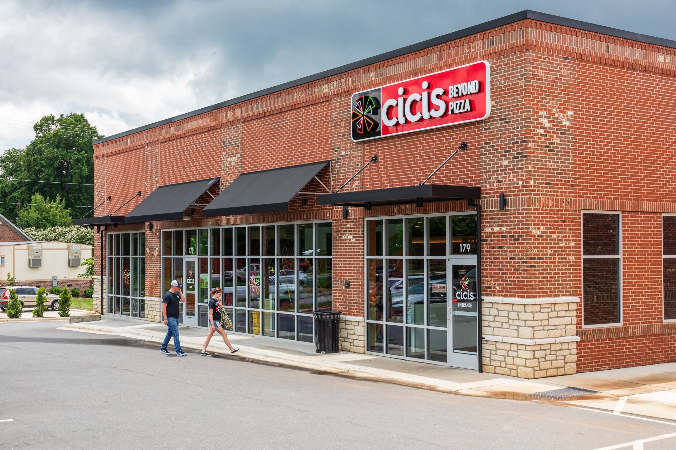 Statesville, NC, USA-June 19, 2019: A local Cicis Beyond Pizza restaurant, with customers entering the building.