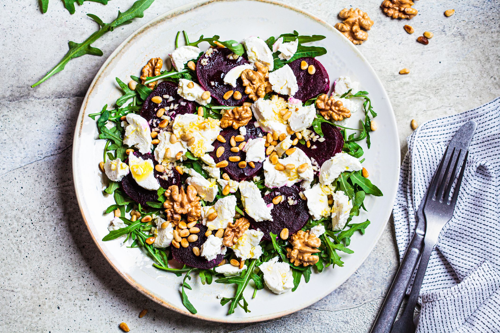 Baked beetroot salad with arugula, nuts and goat cheese.