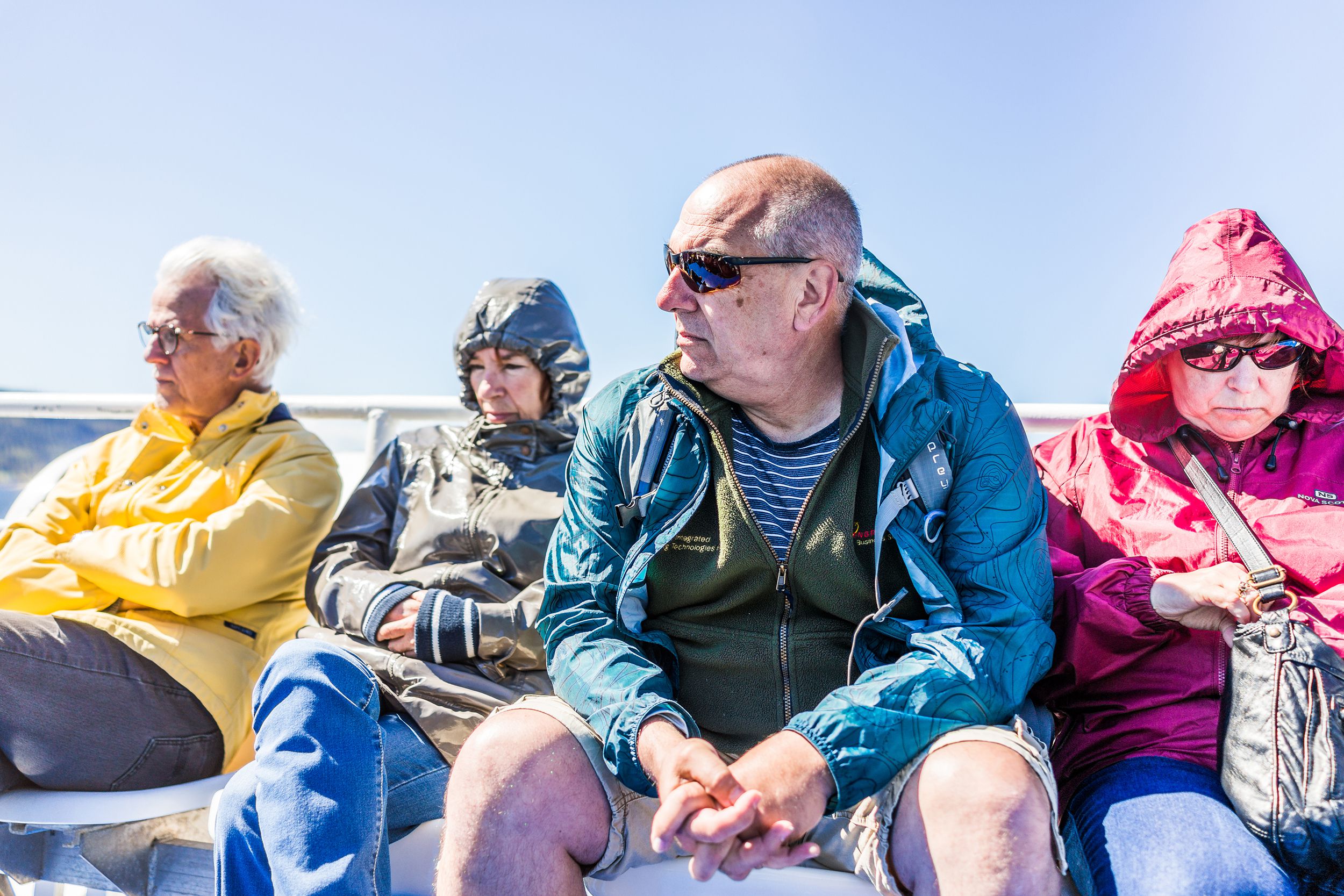 people tourists sitting on boat tour