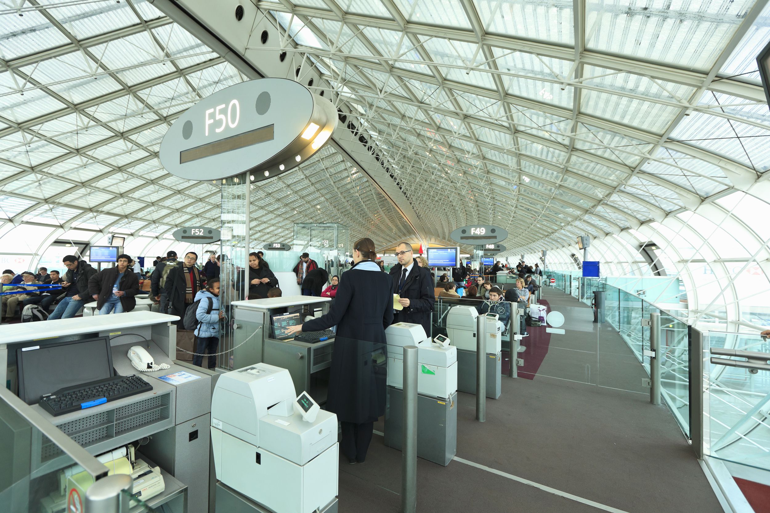 travelers queueing for boarding at CDG, France