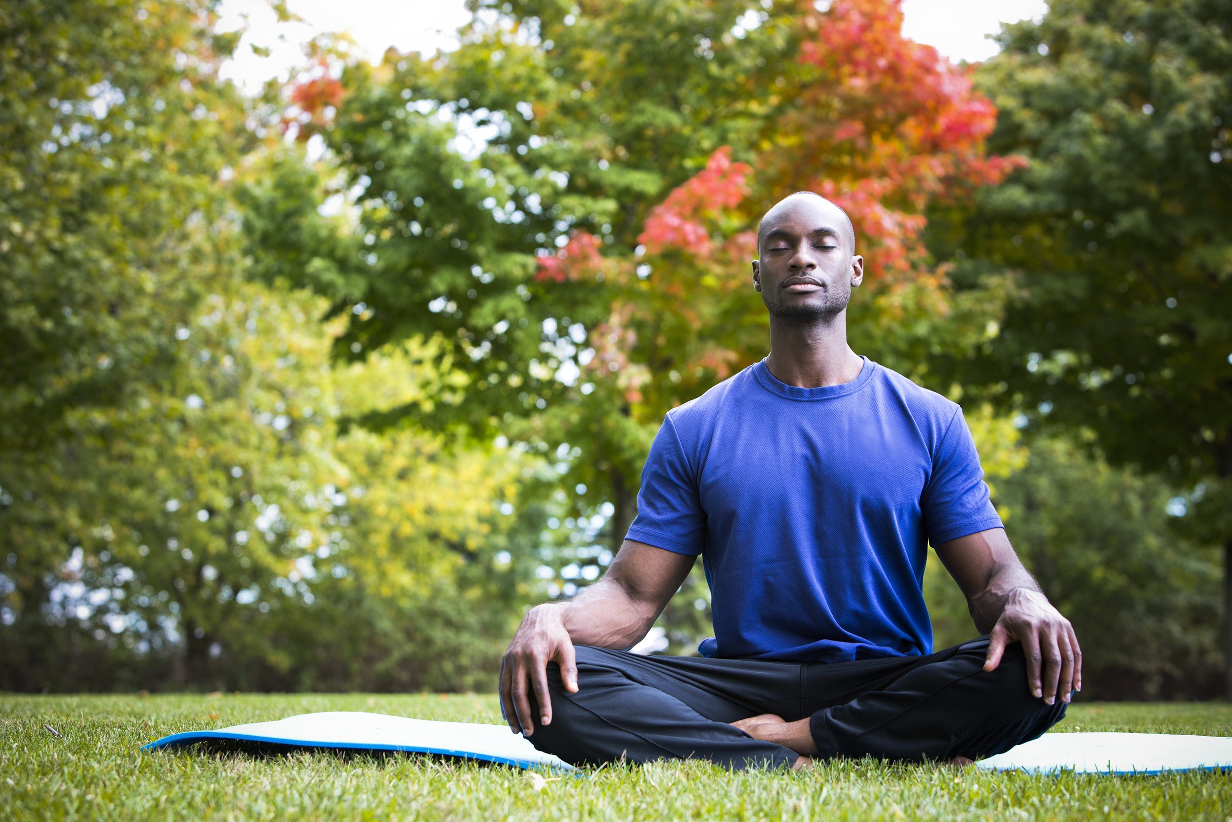 Man meditating outside