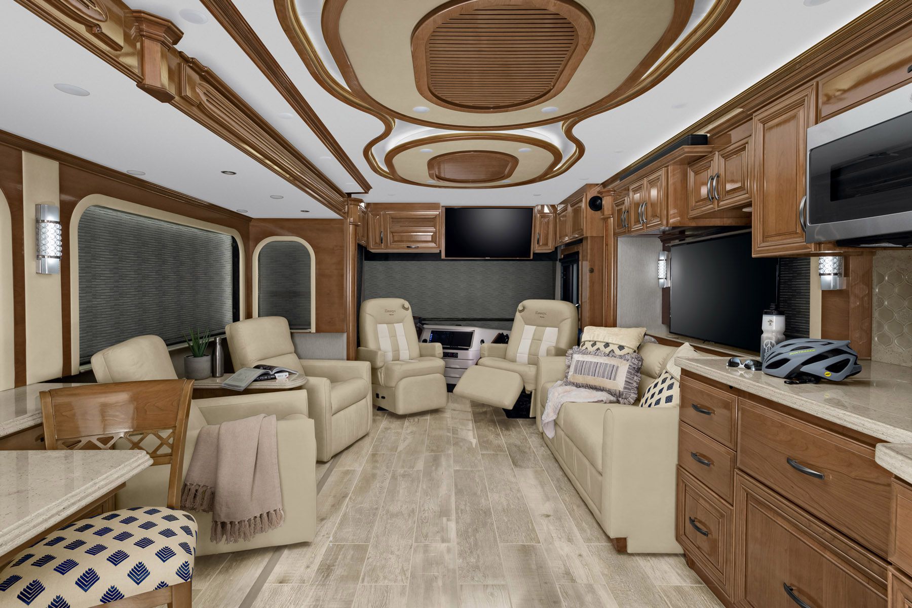 Interior of Newmar Essex, seating area, light beige coloring with wooden accents