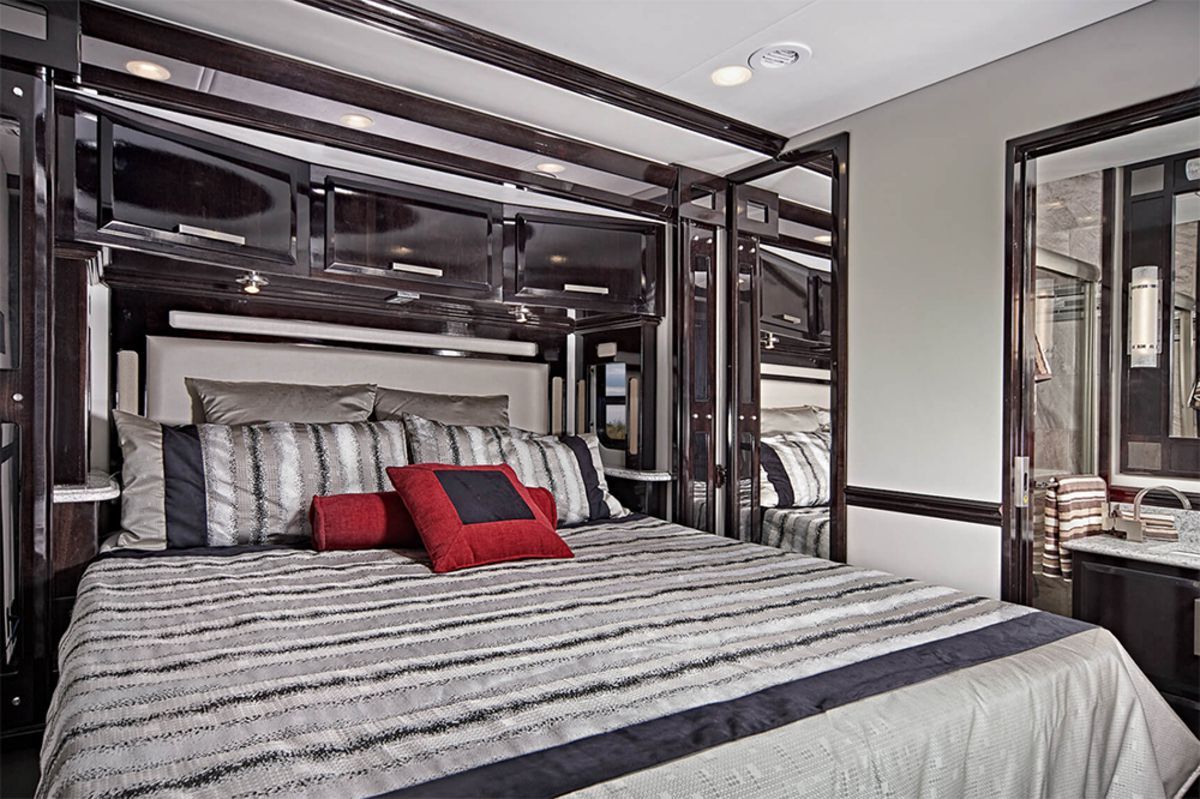 Interior of Renegade Ikon, large bed with glossy dark brown-grey accents