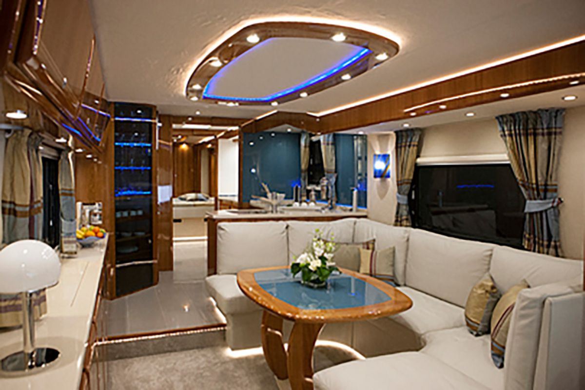 Interior of Volkner Performance S, seating area, very well-lit with light brown wooden accents
