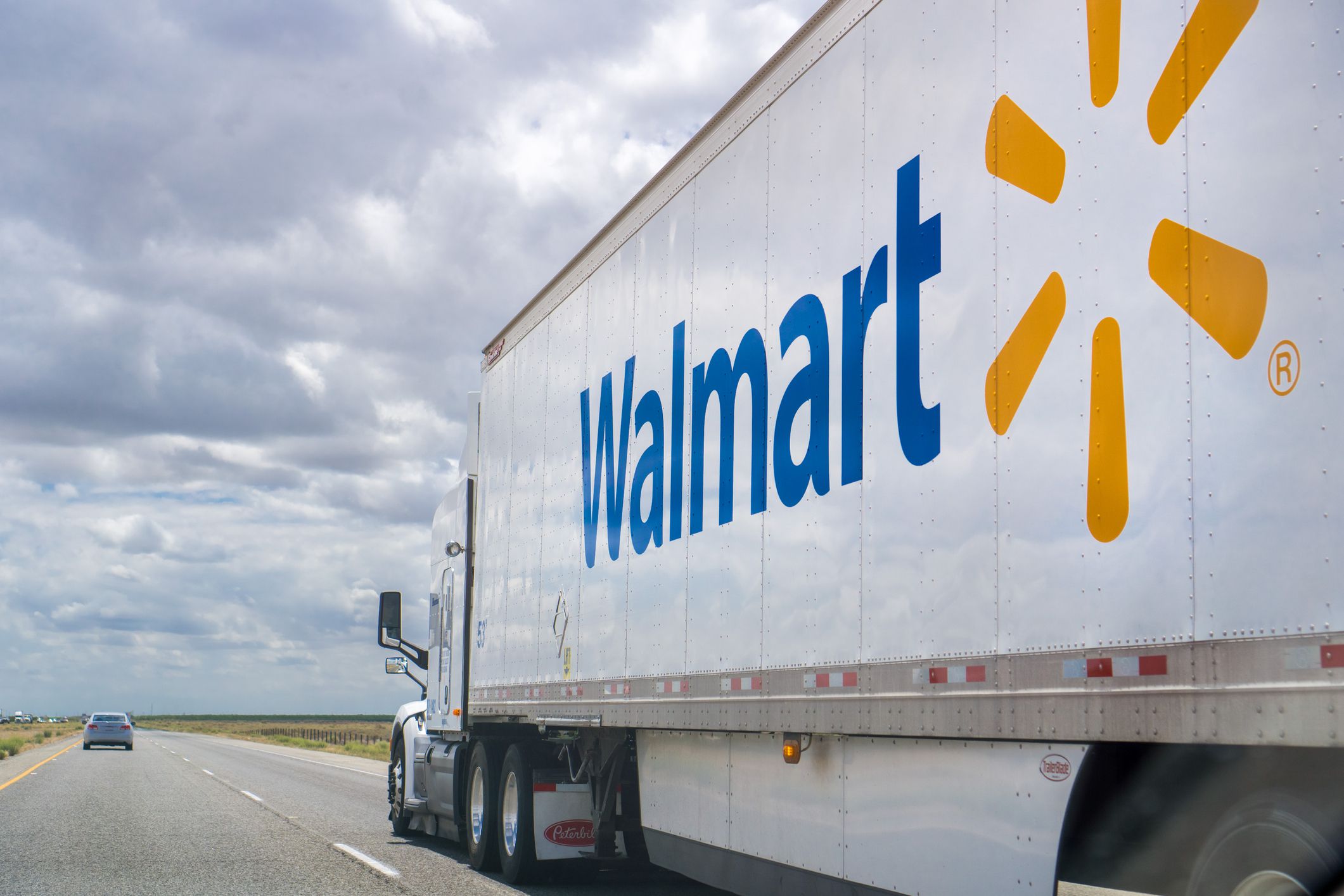 Walmart truck driving on the interstate near Bakersfield, California on a cloudy day