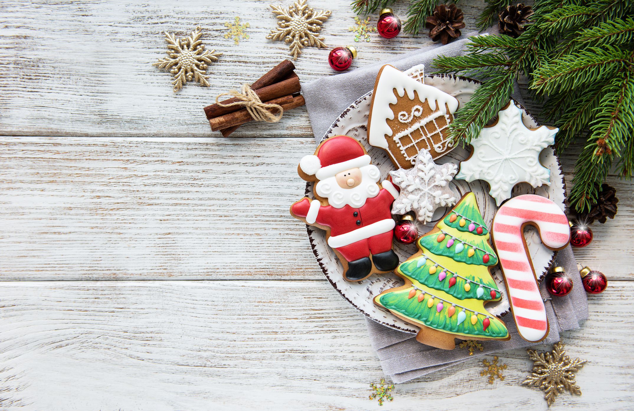 Christmas cookies and Christmas tree on a old wooden table