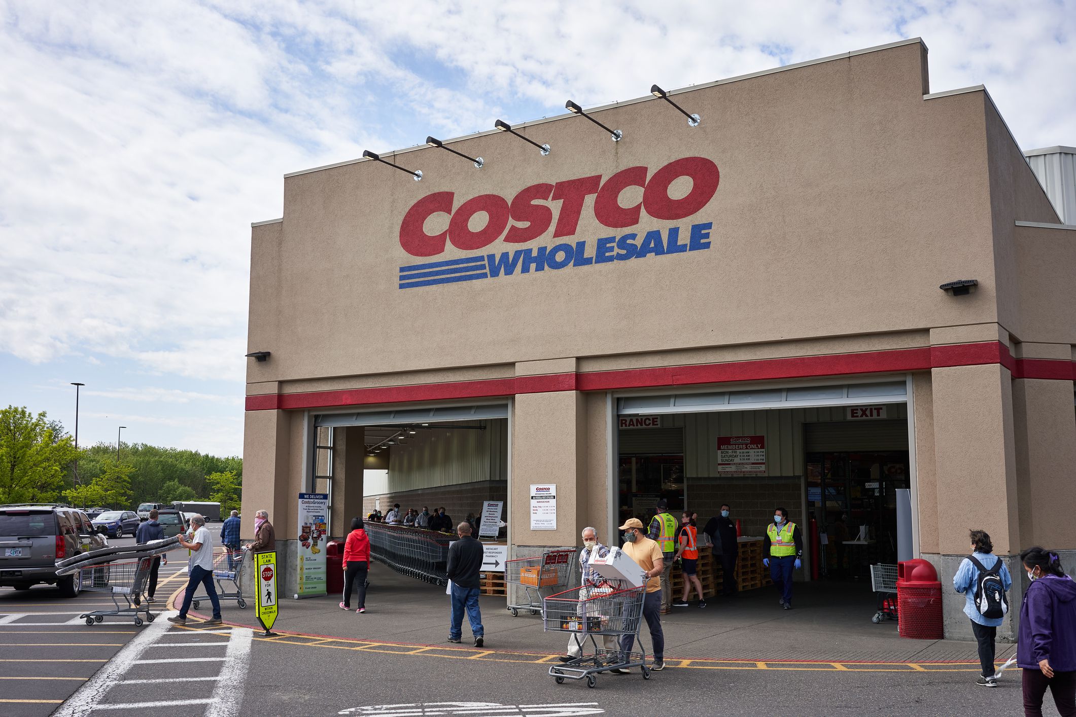 Tigard, OR, USA - May 5, 2020: Masked shoppers outside a Costco store in Tigard, Oregon. Costco updated its coronavirus response and implemented face covering policy in stores on Monday.