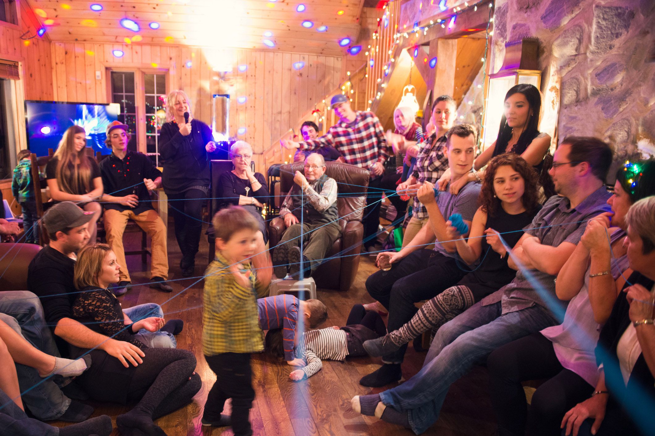 overcrowded living room with large family at holiday time