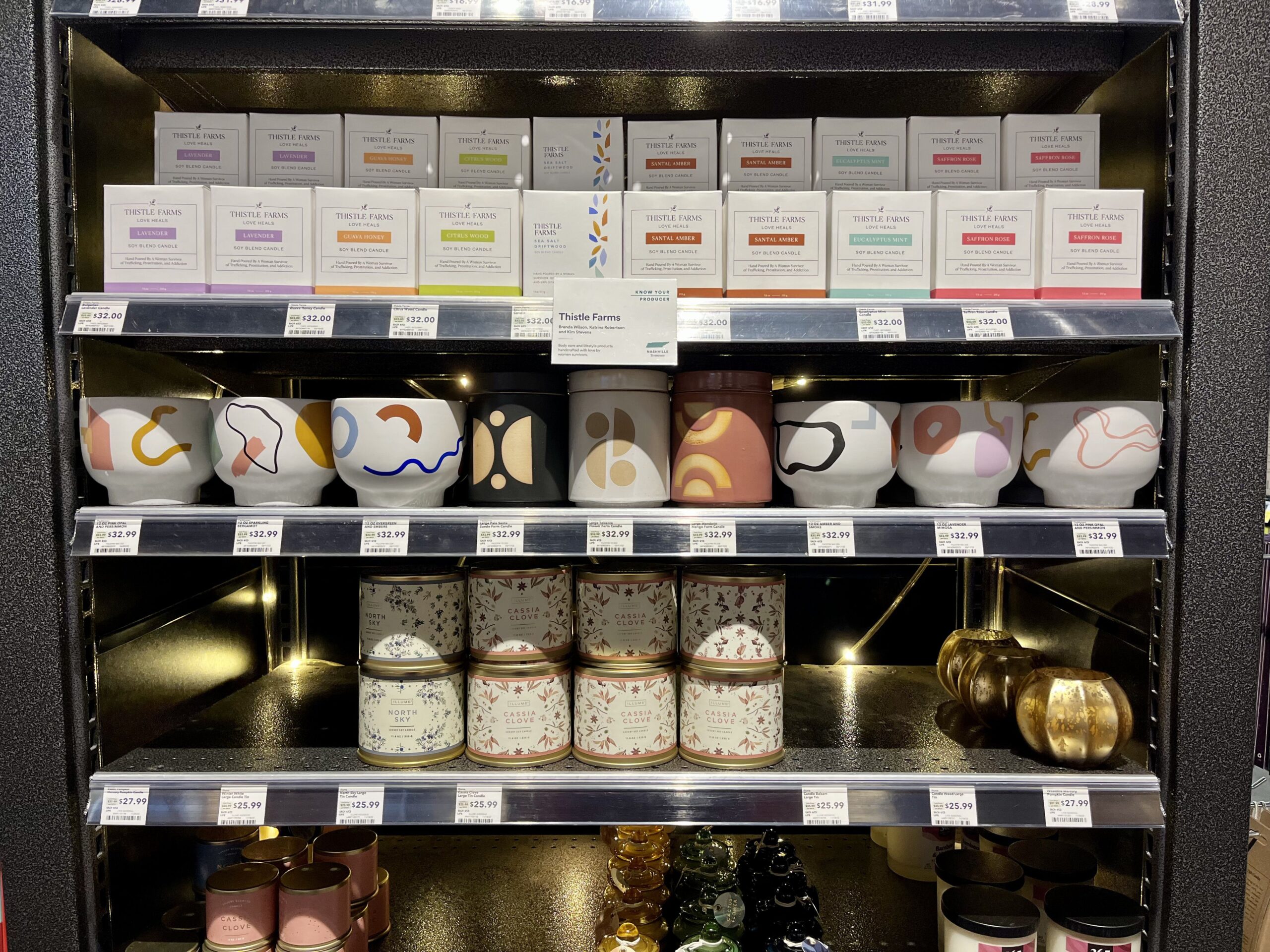 a wall of candles at whole foods