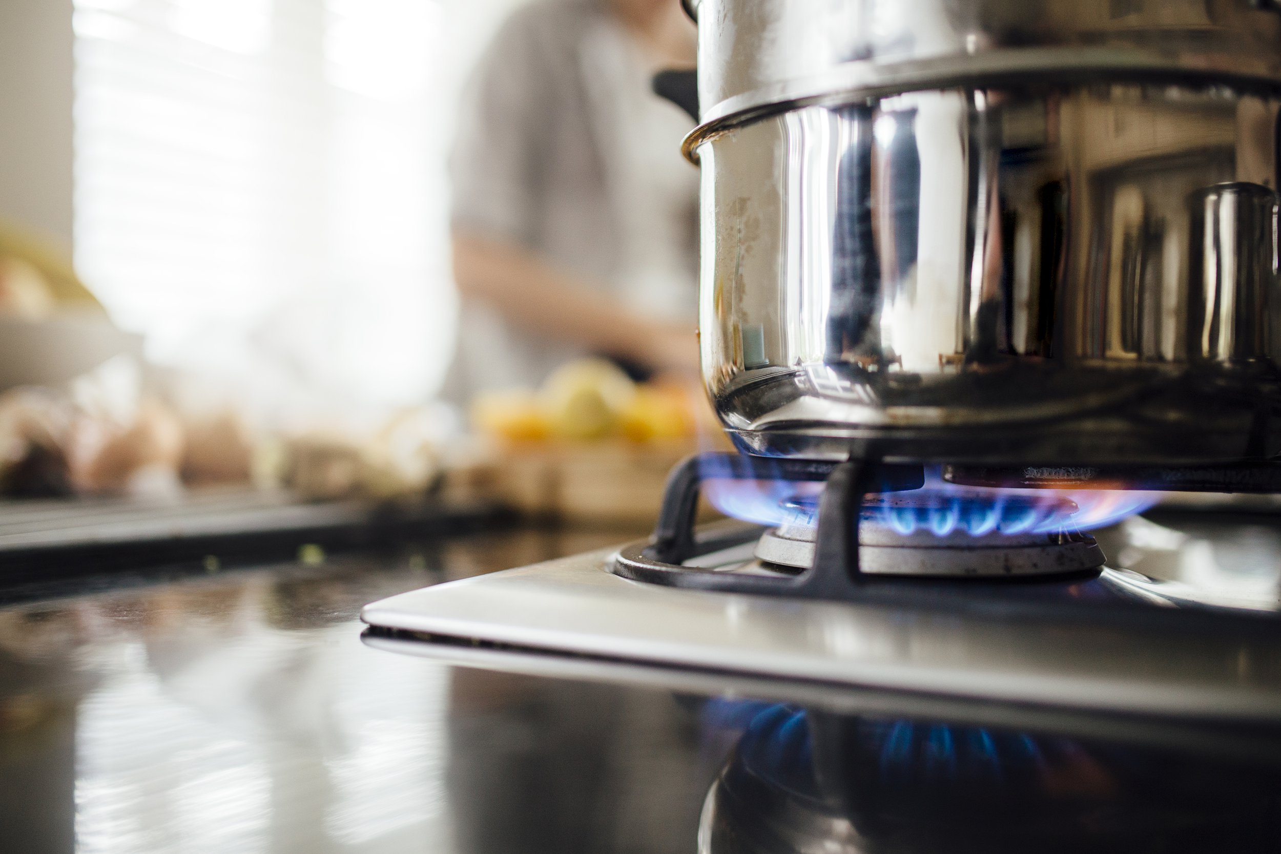 Pot in a gas stove with burner turned on